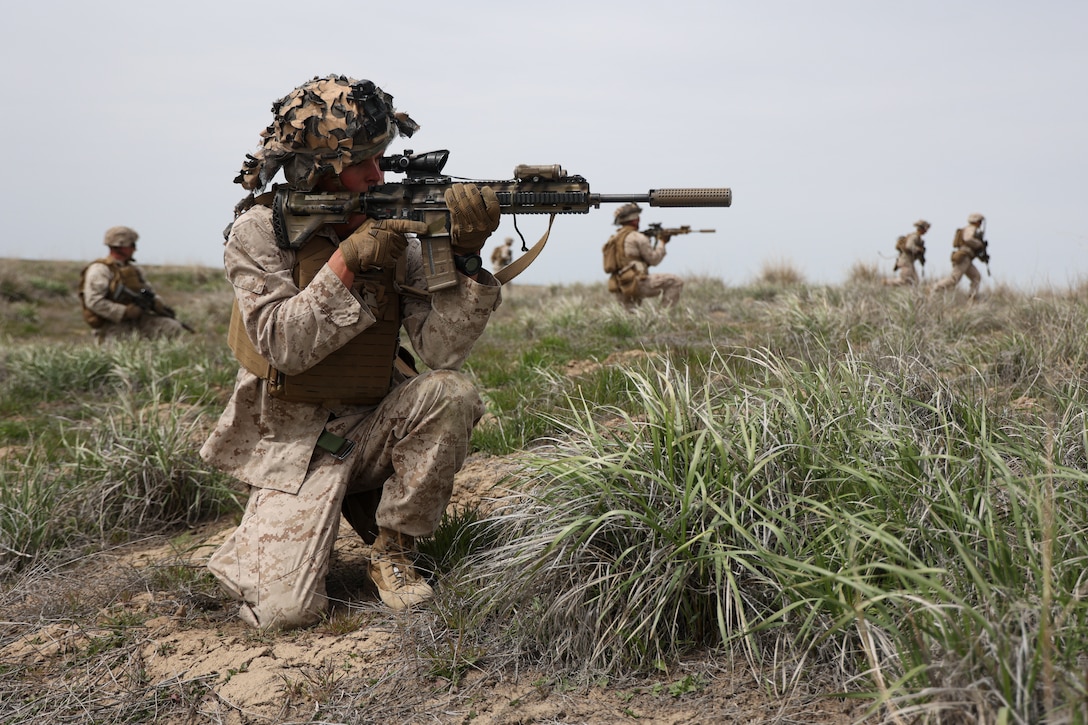 U.S. Marine Cpl. Dylan Guggenmos, a rifleman with 1st Marine Division 1st Battalion 7th Marines, waits for a dry fire event to start on Saylor Creek Range in Grasmere Idaho during exercise Garnet Rattler May 18, 2022. Garnet Rattler is a joint exercise between Marines, Soldiers and Airmen to train Joint Terminal Attack Controllers to be more efficient and lethal in a realistic training environment.