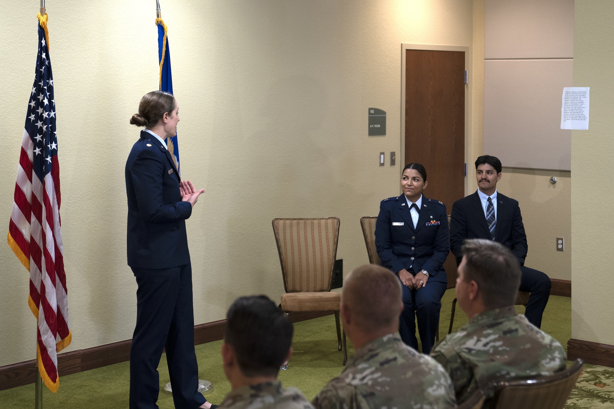 U.S. Air Force Maj. Amanda Delgado, 81st Surgical Squadron OBGYN physician, gives the oath of office to 2nd Lt. Jose Delgado Jr., Texas Rio Grande Valley school of medicine student, at Keesler Air Force Base, Mississippi, June 6, 2022. Amanda shared her promotion ceremony with her younger brother with their father there to witness. (U.S Air Force photo by Airman 1st Class Trenten Walters)