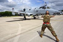 A U.S. Air Force Airman from the 127th Aircraft Maintenance Squadron, Selfridge Air National Guard Base, Mich., performs Agile Combat Employment training while marshaling an A-10 Thunderbolt II in an Integrated Combat Turn during Agile Rage 22, June 7, 2022.