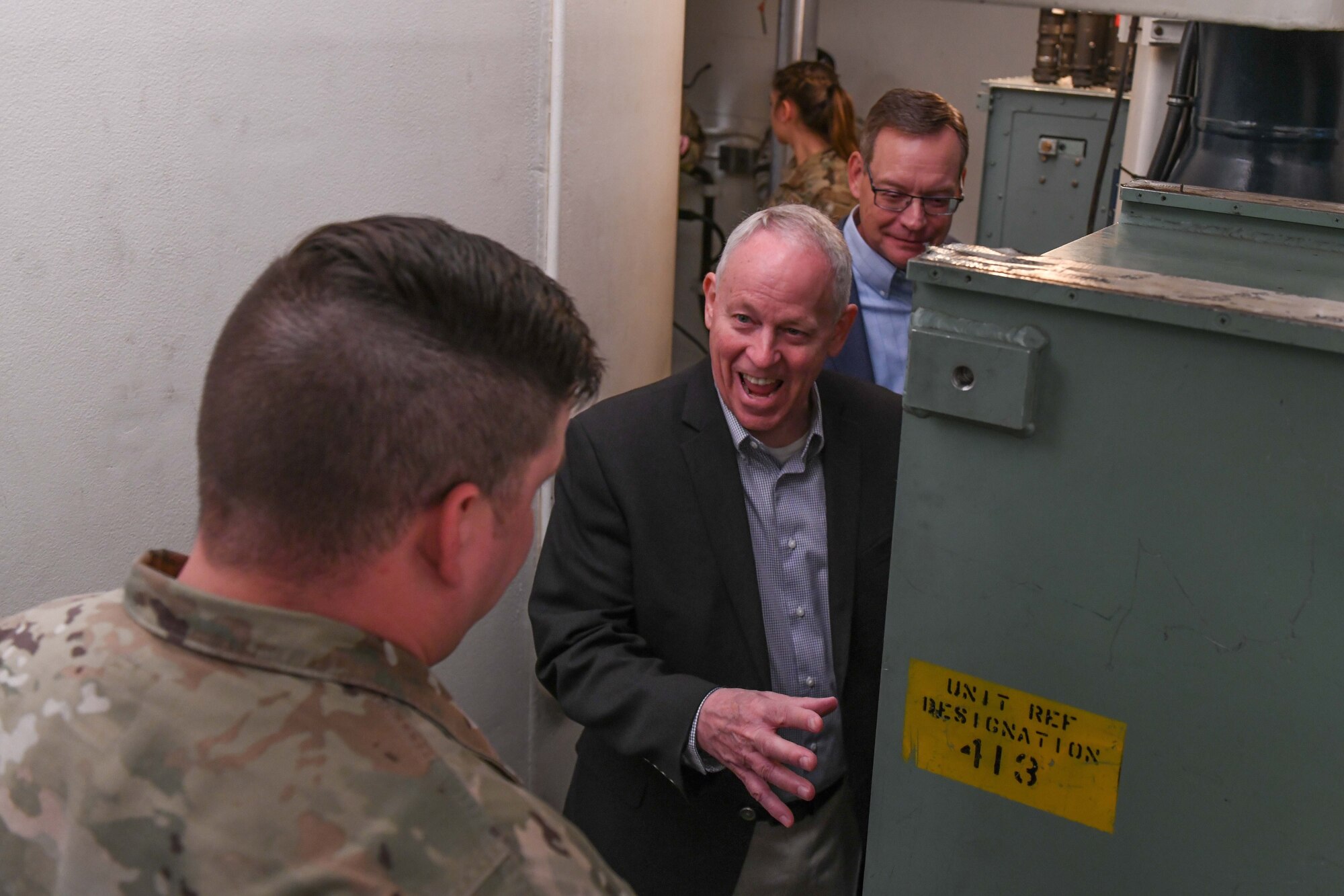 people stand in a training missile silo