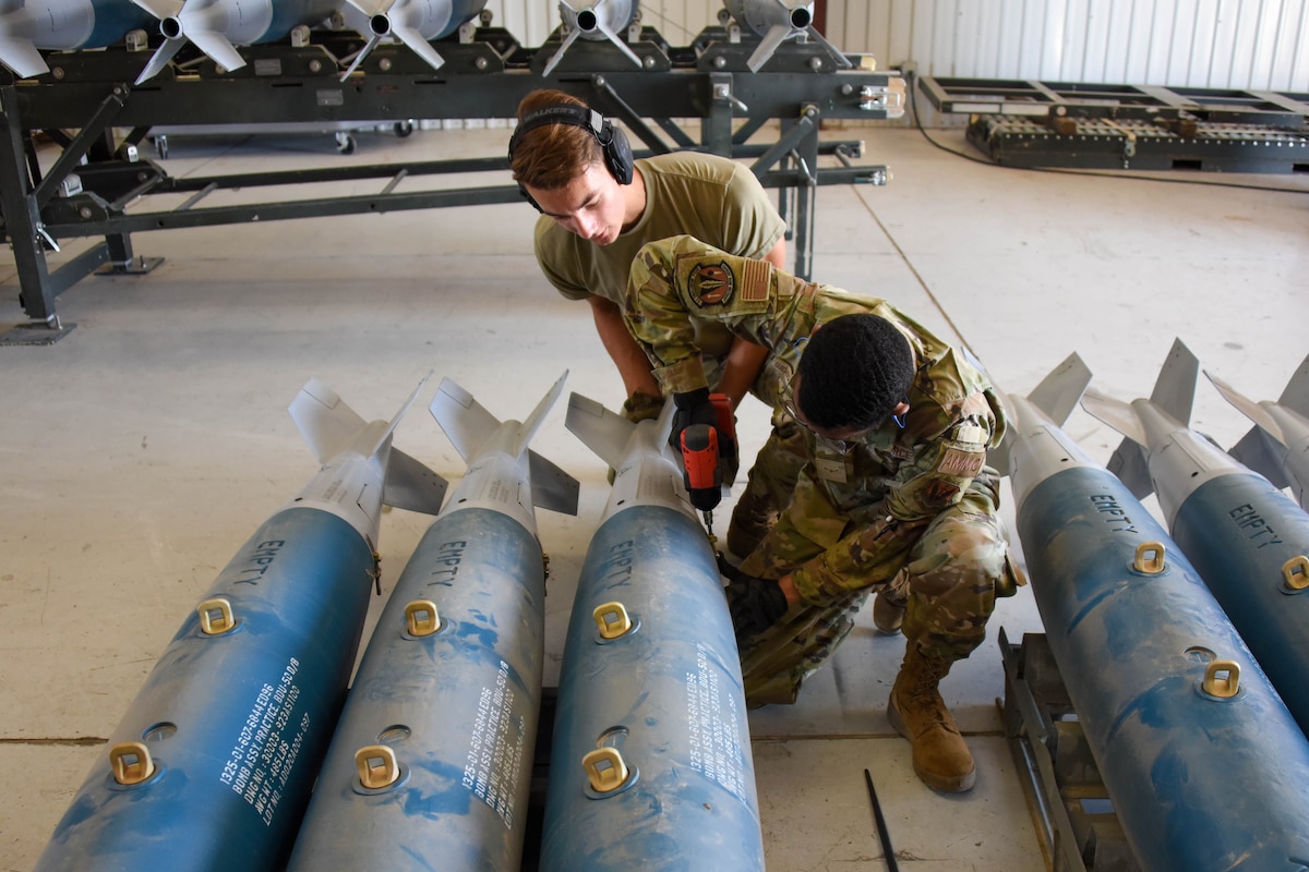 A photo of Airmen maintaining munitions.