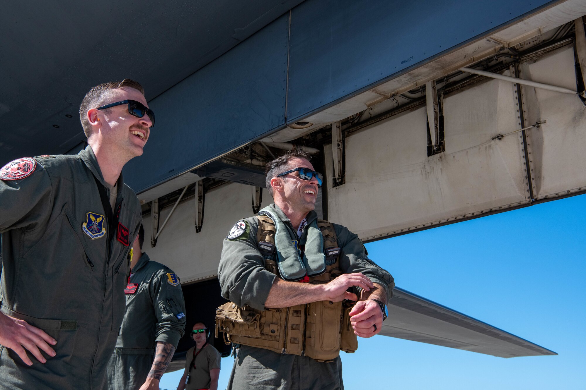 U.S. Air Force Maj. Kristof Lieber (left), the assistant director of operations for the 34th Bomb Squadron, and Lt. Col. Ross Hobbs (right), the commander of the 34th Bomb Squadron, greet each other at Anderson Air Force Base, Guam, after landing a B-1B Lancer for a Bomber Task Force mission on June 2, 2022.