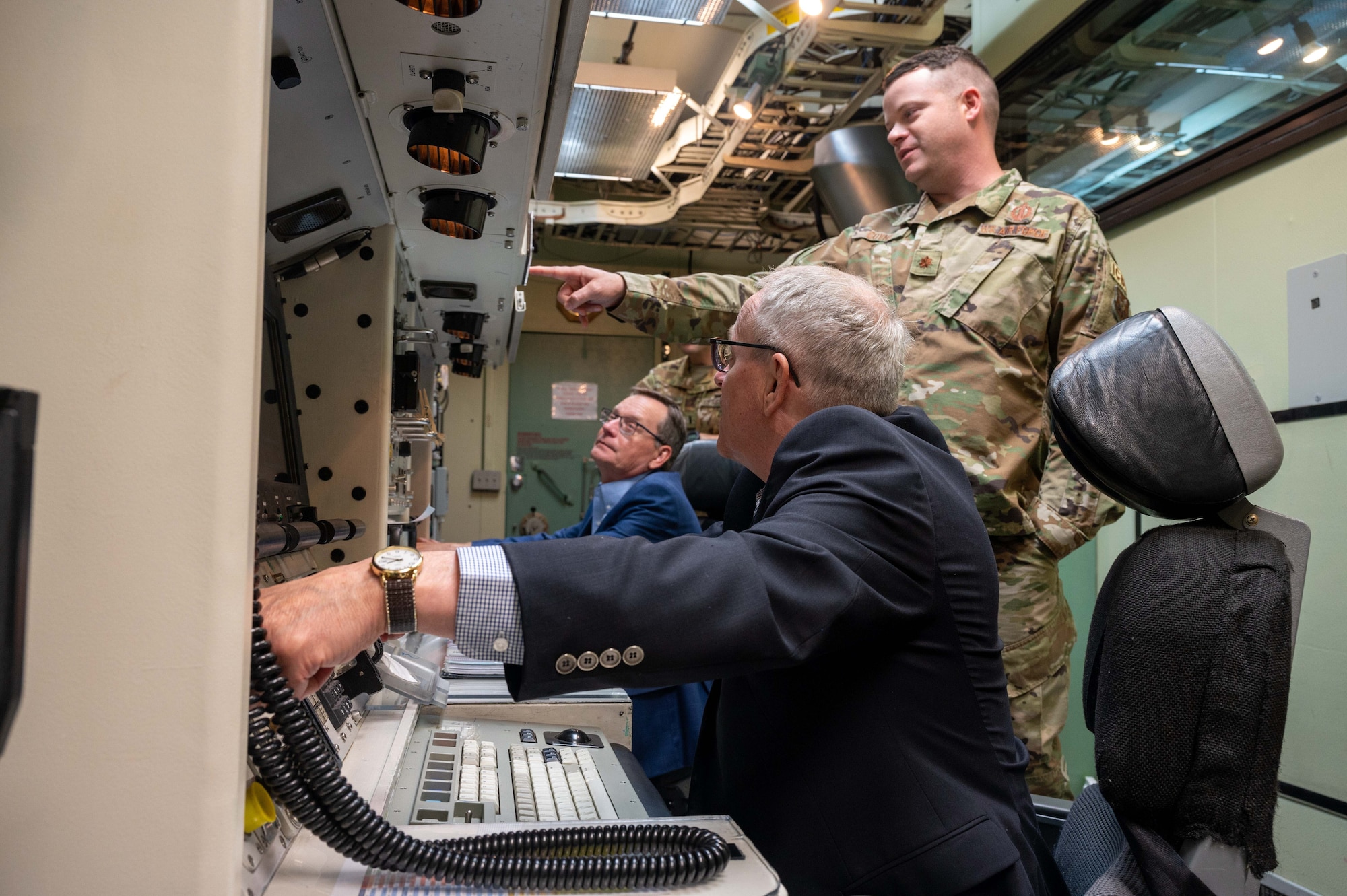 people operate a machine