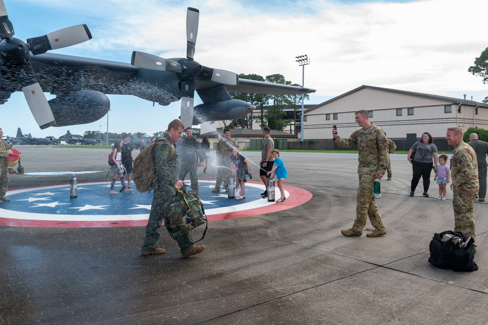 Air Commandos and family gather on the flight line to commemorate the  MC-130H Combat Talon IIs final flight under the 492nd Special Operations Wing at Hurlburt Field, Florida, May 31, 2022.