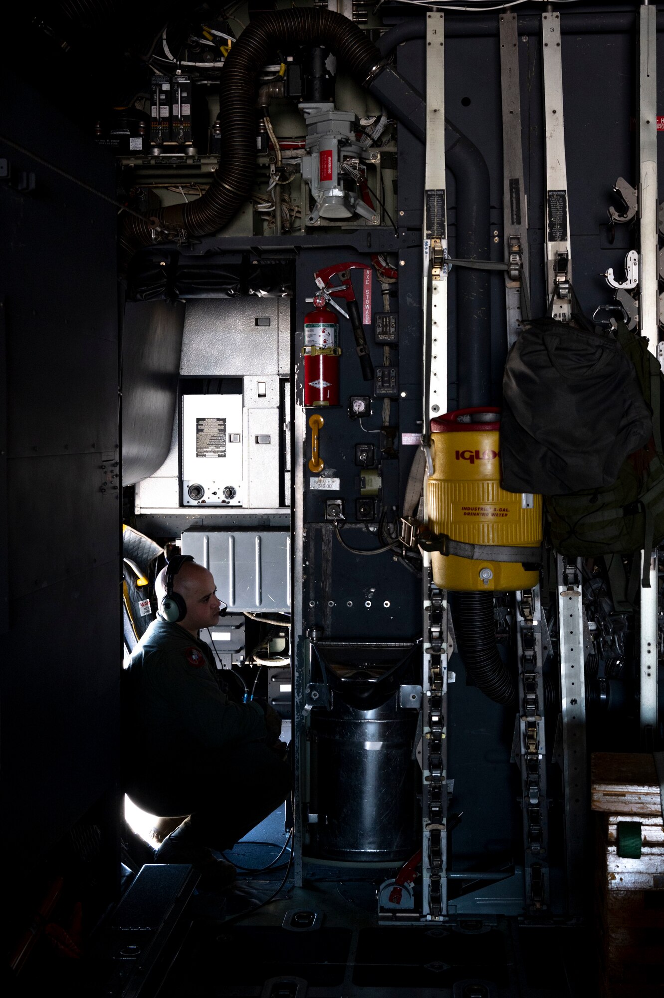 U.S. Air Force Master Sgt. Adrian Garcia, 19th Special Operations Squadron operations superintendent, waits to close the door on an MC-130H Combat Talon II for its final flight under the 492nd Special Operations Wing at Hurlburt Field, Florida, May 31, 2022.