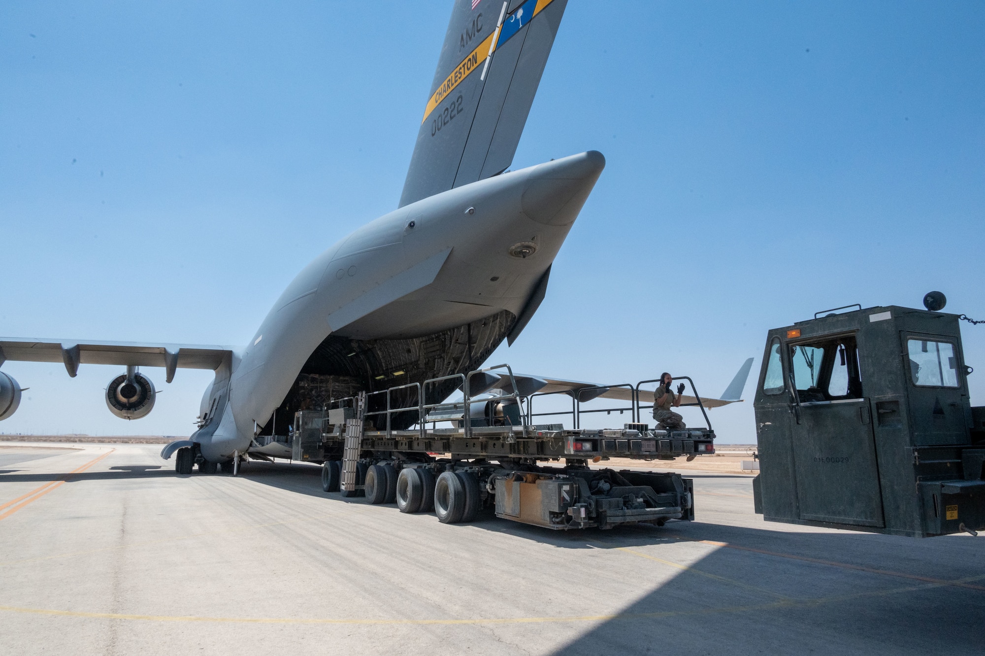 332d Expeditionary Logistics Readiness Squadron Aerial Port Airmen prepare to load cargo into a C-17 Globemaster III aircraft at an undisclosed location in Southwest Asia, May 7, 2022. Working in concert to coordinate movement of aircraft, passengers, equipment, and everything else requiring air travel, the 332d ELRS’s Aerial Port enables the 332d Air Expeditionary Wing to continue to provide regional security throughout its area of responsibility.