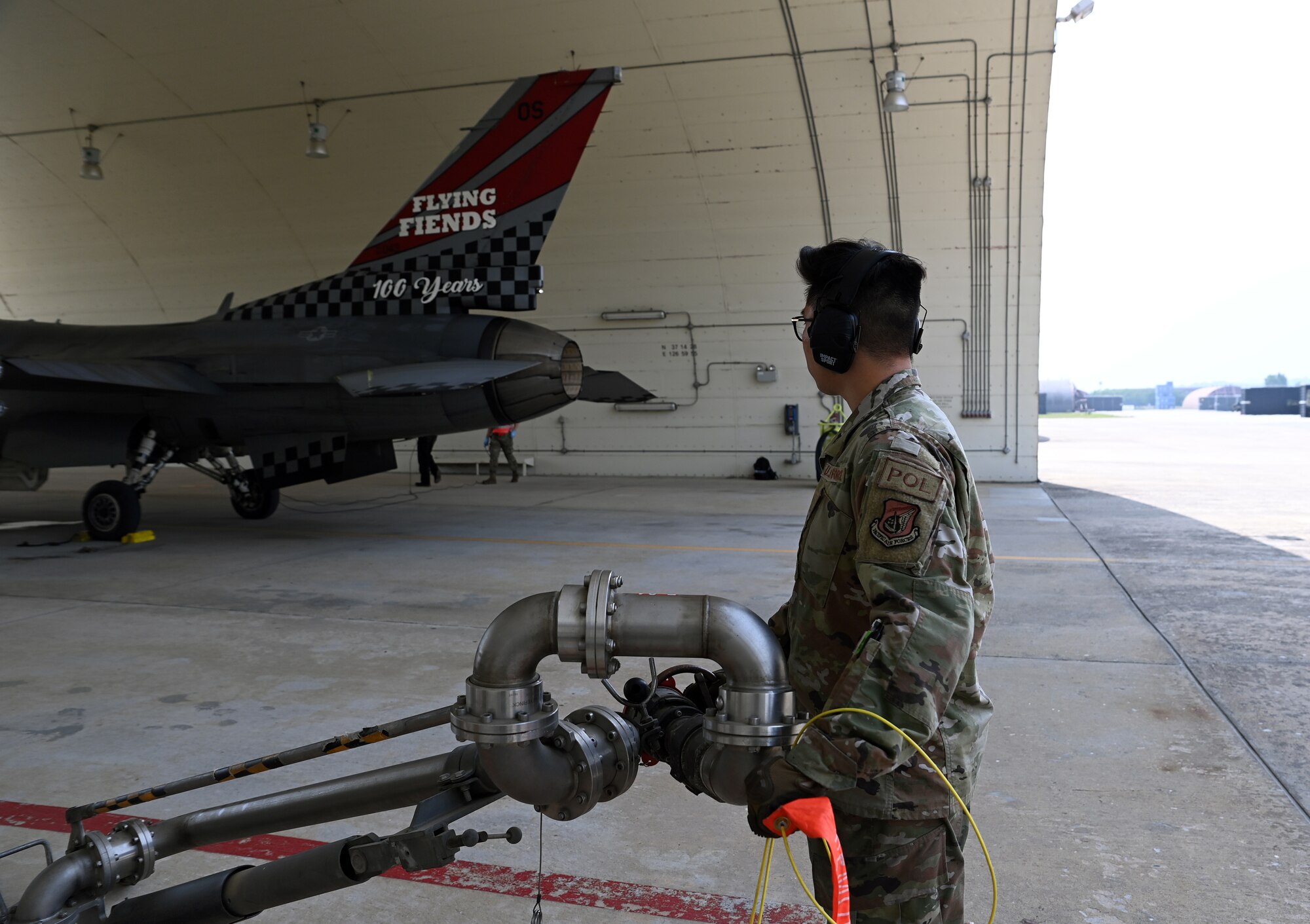 Senior Airman Derek Pyon, 51st Logistics Readiness Squadron Petroleum, Oil, & Lubricants, prepares to bring a pantograph refueling system to a 36th Fighter Squadron F-16 Fighting Falcon at Suwon Air Base, Republic of Korea, June 2, 2022. The pantograph provides on-demand fuel at the squeeze of a handle and provides fuel support to multiple aircraft at the same time, reducing the work-load and turn-times of the mobile refueling fleet. (U.S. Air Force photo by Master Sgt. Rachelle Morris)