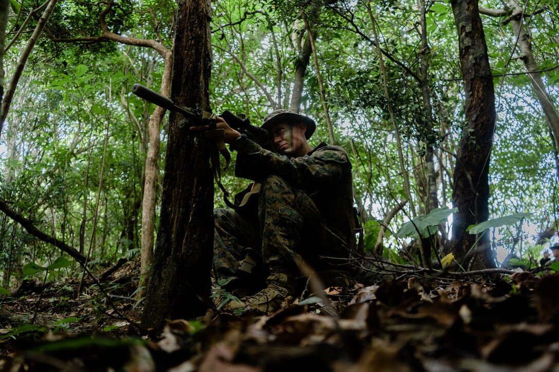 U.S. Marine Corps Lance Cpl. Gage Thompson, a rifleman with 3d Battalion, 2d Marines, 3d Marine Division, provides security during a rapid response drill on Okinawa, Japan, May 19, 2022. III Marine Expeditionary Force executed these actions as part of a series of integrated no-notice drills to maintain their high state of readiness and demonstrate U.S. resolve to maintain regional security. 3/2 is forward-deployed under 4th Marines as a part of the Unit Deployment Program. (U.S. Marine Corps Cpl. Scott Aubuchon)