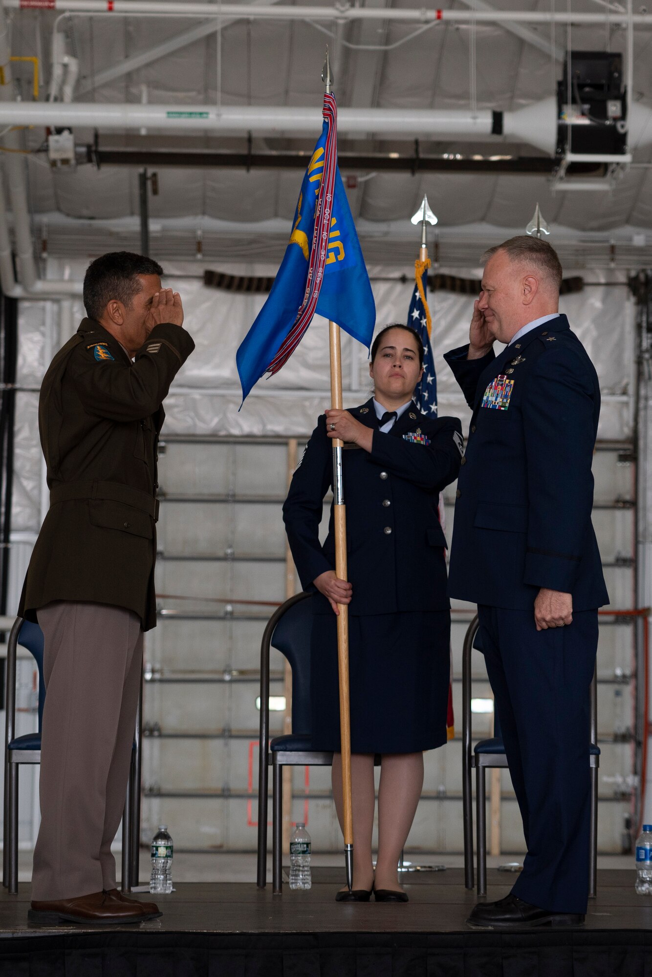 Maj. Gen. David Mikolaities, New Hampshire Adjutant General, receives a salute from Brig. Gen. John Pogorek during a ceremony June 4, 2022, at Pease Air National Guard Base, N.H. During the three-part ceremony, Pogorek passed command of the 157th Air Refueling Wing to Col. Nelson Perron, was promoted to the rank of brigadier general, and then assumed command of the New Hampshire Air National Guard. (U.S. Air National Guard photo by Staff Sgt. Taylor Queen)