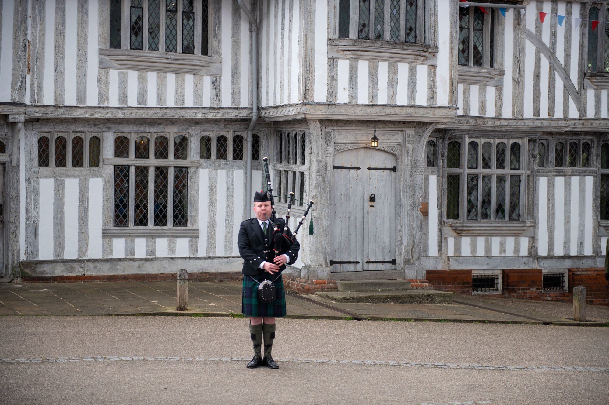 A bagpiper plays during the remembrance ceremony held at Lavenham, England, May 29, 2022.