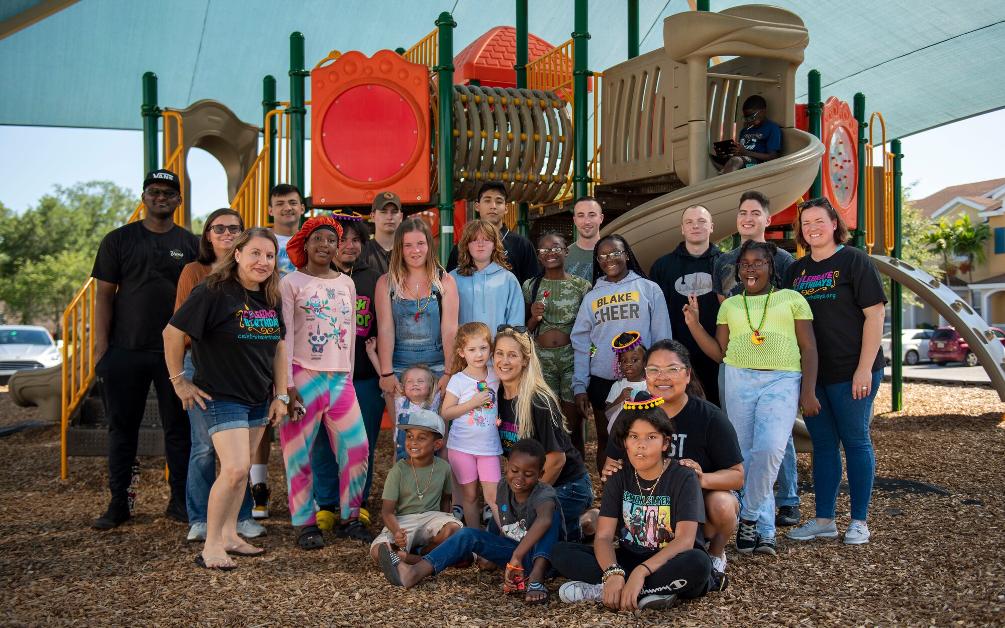 Children gather with service members assigned to MacDill Air Force Base to celebrate the birthdays of children in foster care at the New Life Village campus located in Tampa, Florida, May 29, 2022. New Life village, a residential community dedicated to serving children impacted by foster care or trauma, hosts monthly birthday parties to ensure that all children have the opportunity to celebrate their birthday. (U.S. Air Force photo by Airman 1st Class Lauren Cobin)