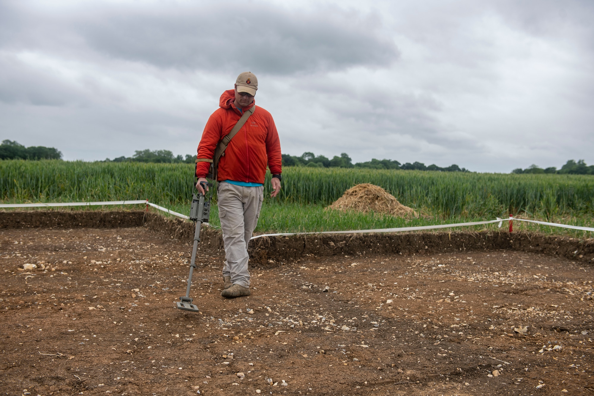 U.S. Air Force Master Sgt. Paul Brow, 48th Civil Engineer Squadron explosive ordnance disposal operations section chief, searches for unexploded ordnance and aircraft wreckage near London-Stansted, England, May 25, 2022. Brow was supporting a Defense POW/MIA Accounting Agency recovery operation for the remains of a U.S. service member whose plane crashed there in 1944. (U.S. Air Force photo by Senior Airman Jason W. Cochran