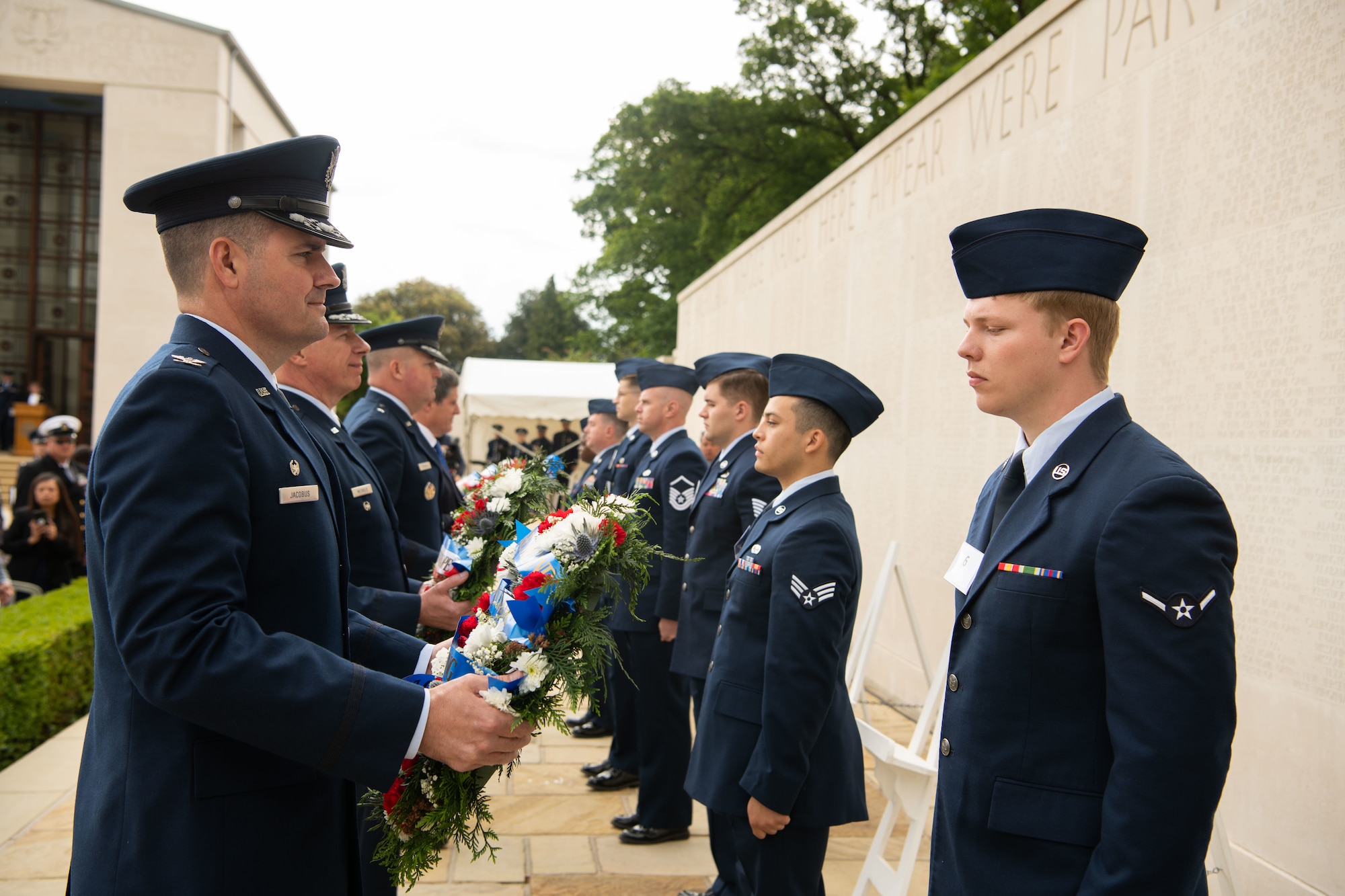 U.S. Air Force Col. Gene Jacobus, 100th Airlift Refueling Wing commander, prepares to lay a remembrance wreath during a M=memorial ceremony at Cambridge American cemetery, at Madingley, England, May 30, 2022.