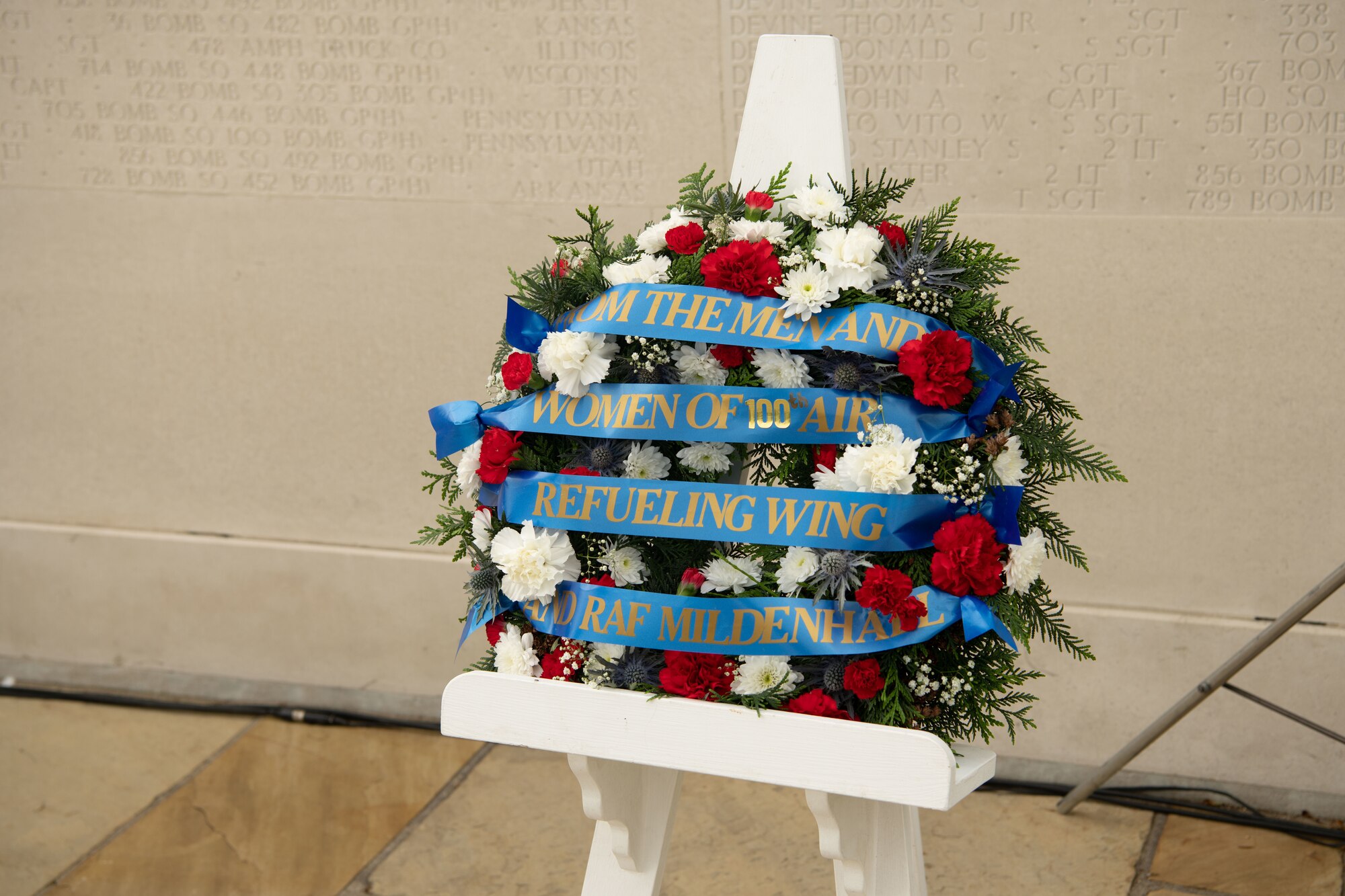 A remembrance wreath is displayed on behalf of the 100th Airlift Refueling Wing during a memorial ceremony at Cambridge American cemetery, at Madingley, England, May 30, 2022.