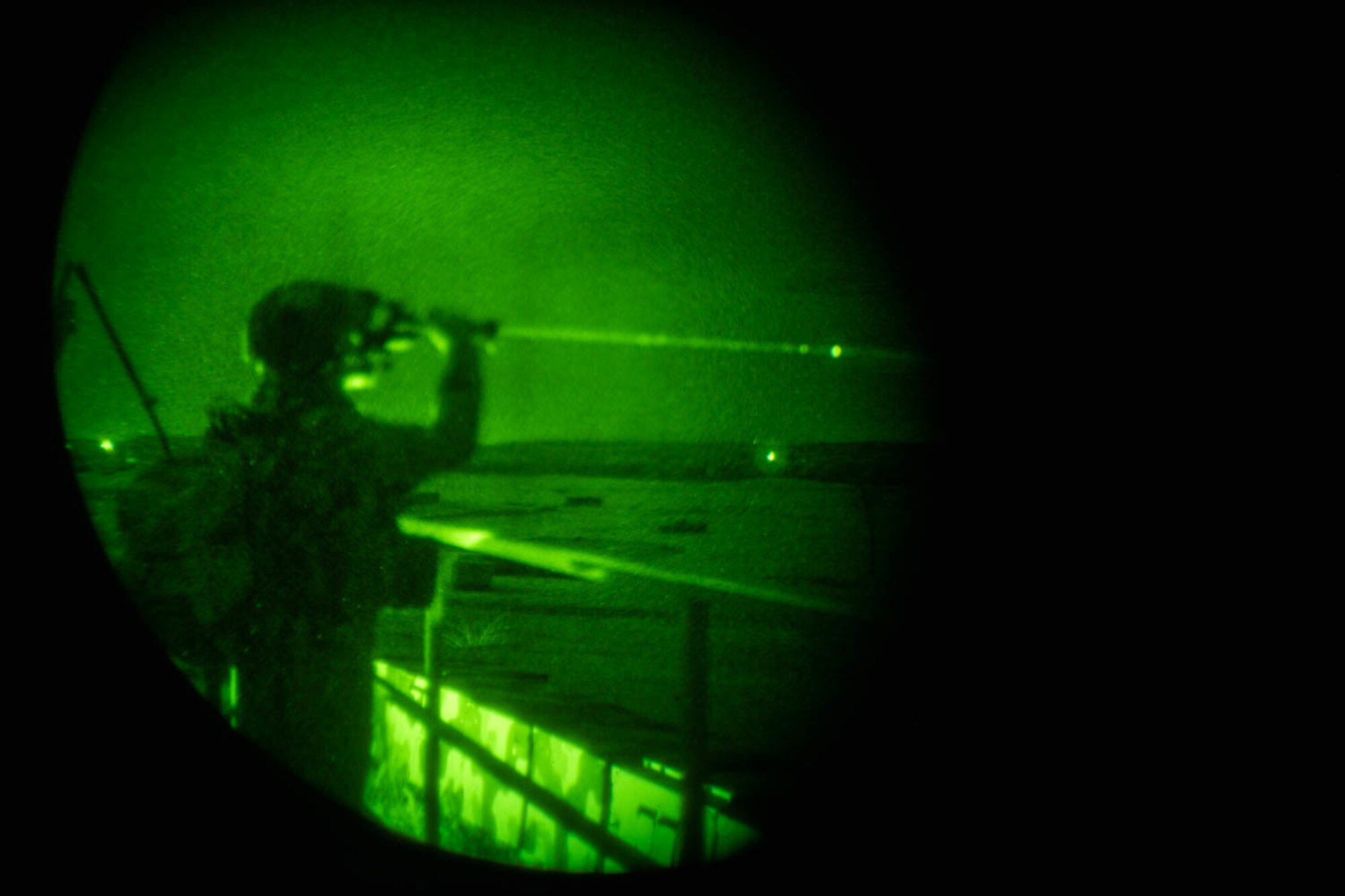 Person in night vision lens