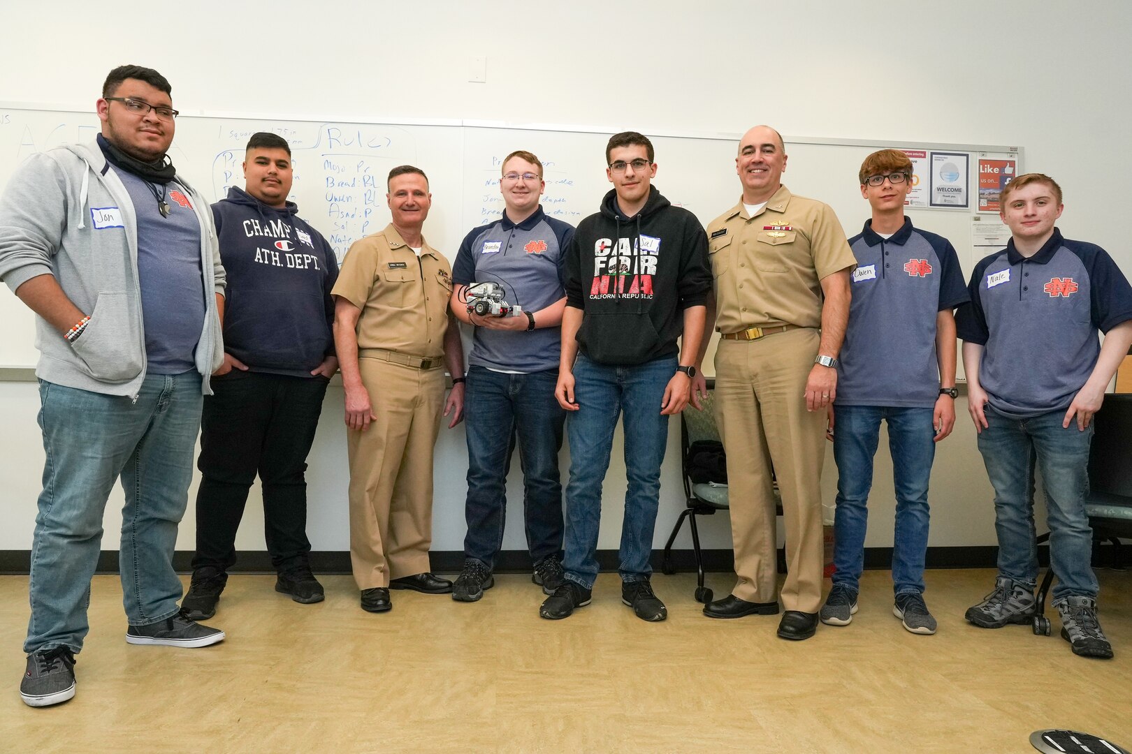 IMAGE: Vice Adm. William Galinis, third from left, Naval Surface Warfare Center Dahlgren Division Commanding Officer Capt. Philip “Phil” Mlynarski, third from right, take a picture with the North Stafford High School robotics team during the Innovation Challenge @Dahlgren. The robotics competition featured teams from 12 area public, private and governor’s high schools vying for a total of $5000 in cash prizes.