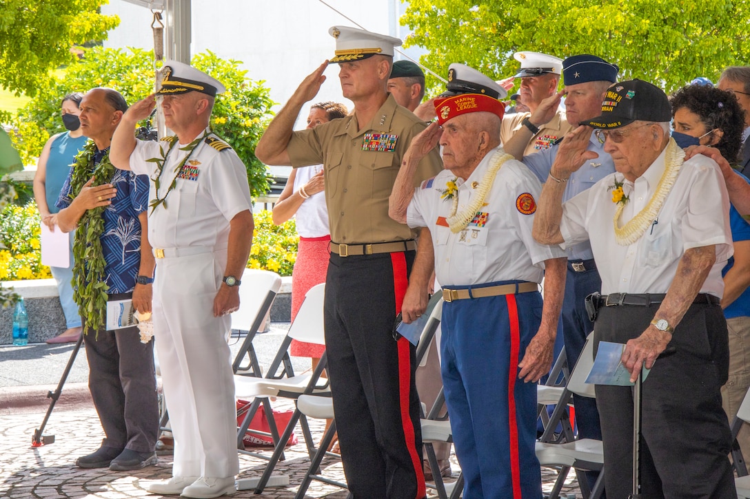 U.S. Marine Corps Lt. Gen. Steven R. Rudder, commander, U.S. Marine Corps Forces, Pacific, and attendees stand for the national anthem during the Battle of Midway Commemoration Ceremony at the National Memorial Cemetery of the Pacific in Honolulu, Hawaii, June 7. This year marks the 80th anniversary of the Battle of Midway. Honored attendees included Ed Fox (second from right), a U.S. Marine Corps Sergeant, and Julian Hodges (far fight), a U.S. Navy Petty Officer 1st Class. Both served in the Battle of Midway.