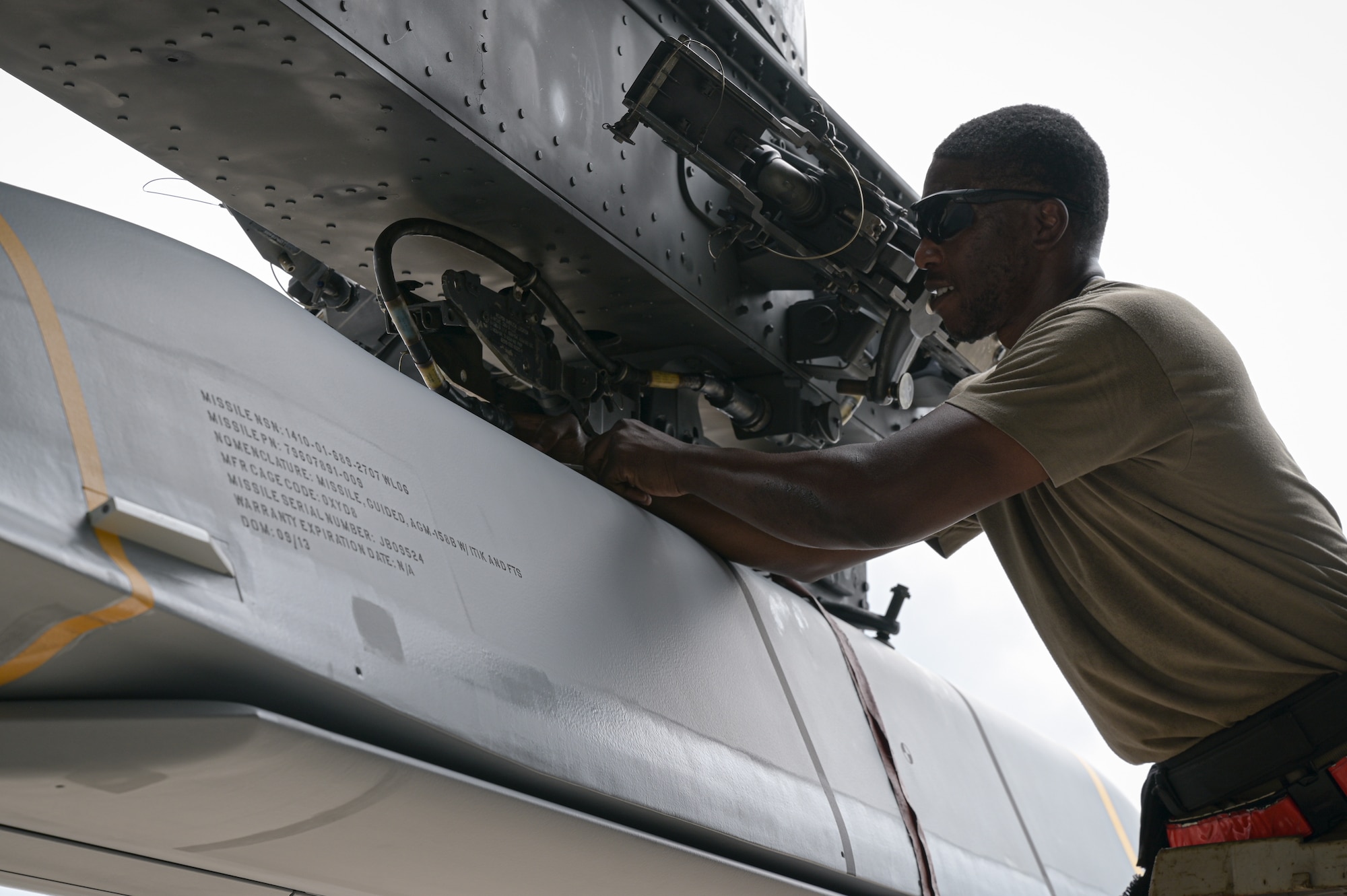 Staff Sgt. Schnathan Johnson, 96th Aircraft Maintenance Unit weapons load team chief, inspects a AGM-158 munition to verify its properly fastened onto a B-52H Stratofortress during Combat Hammer at Barksdale Air Force Base, Louisiana, June 7, 2022. Airmen from the 96th AMU loaded and employed nearly 6 types of various munitions and flew a total of eight sorties in support of exercise Combat Hammer. (U.S. Air Force photo by Senior Airman Jonathan E. Ramos)