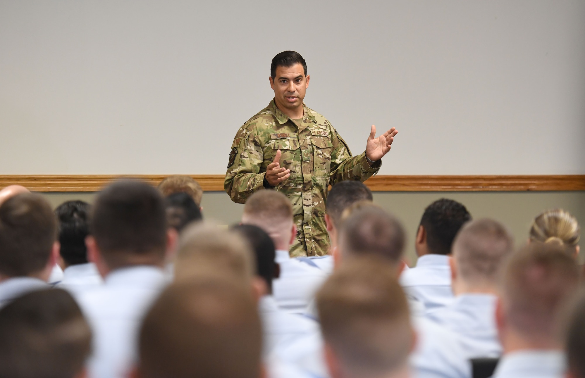 U.S. Air Force Tech. Sgt. August O'Niell, Air Force Wounded Warrior (AFW2) program ambassador, gives a brief to members of the NCO Academy inside Mathies Hall at Keesler Air Force Base, Mississippi, June 6, 2022. The AFW2 program provides concentrated non-medical care and support for combat wounded, ill and injured Airmen and their families as they recover and transition back to duty or into civilian life. (U.S. Air Force photo by Kemberly Groue)