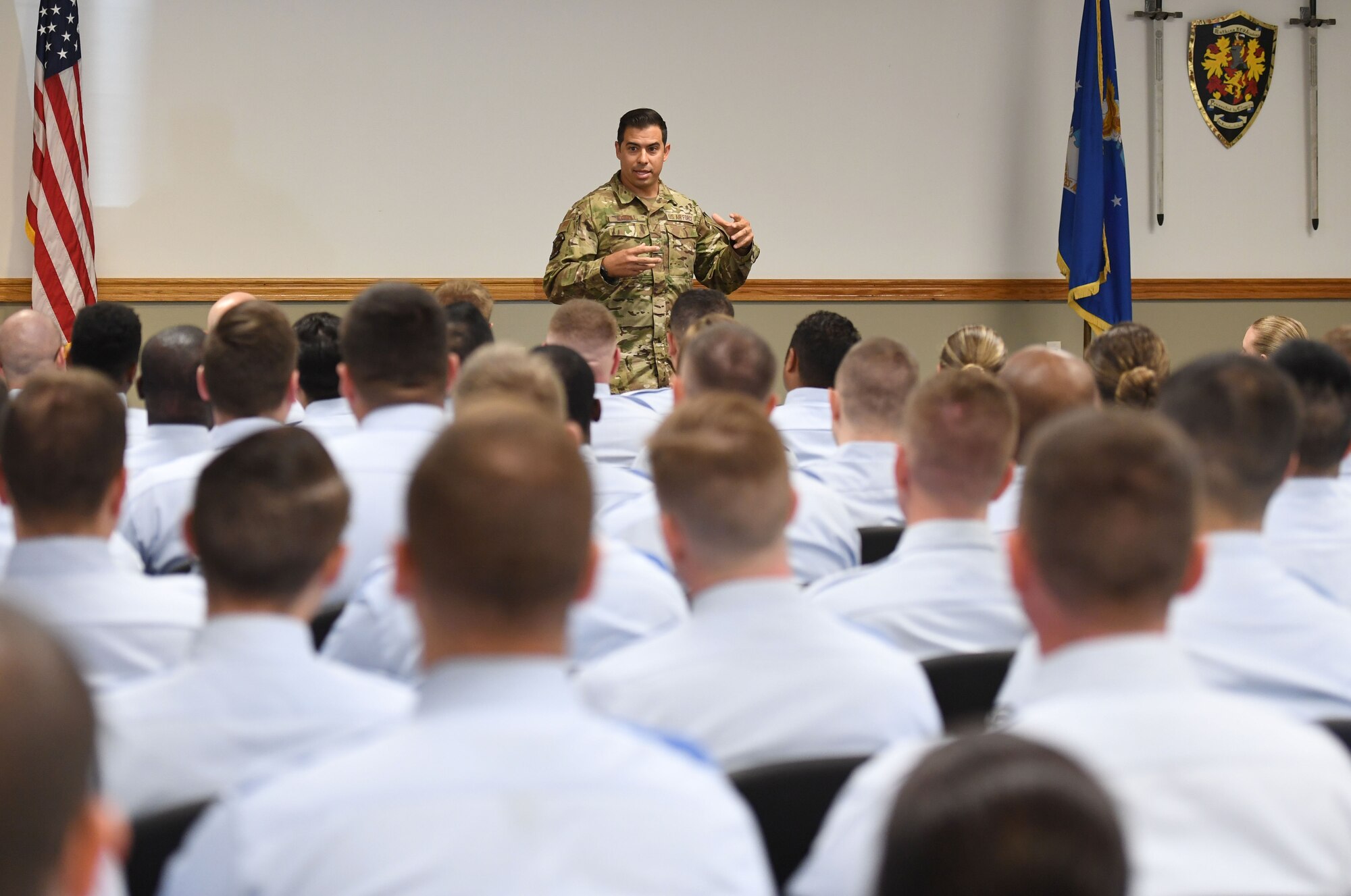 U.S. Air Force Tech. Sgt. August O'Niell, Air Force Wounded Warrior (AFW2) program ambassador, gives a brief to members of the NCO Academy inside Mathies Hall at Keesler Air Force Base, Mississippi, June 6, 2022. The AFW2 program provides concentrated non-medical care and support for combat wounded, ill and injured Airmen and their families as they recover and transition back to duty or into civilian life. (U.S. Air Force photo by Kemberly Groue)