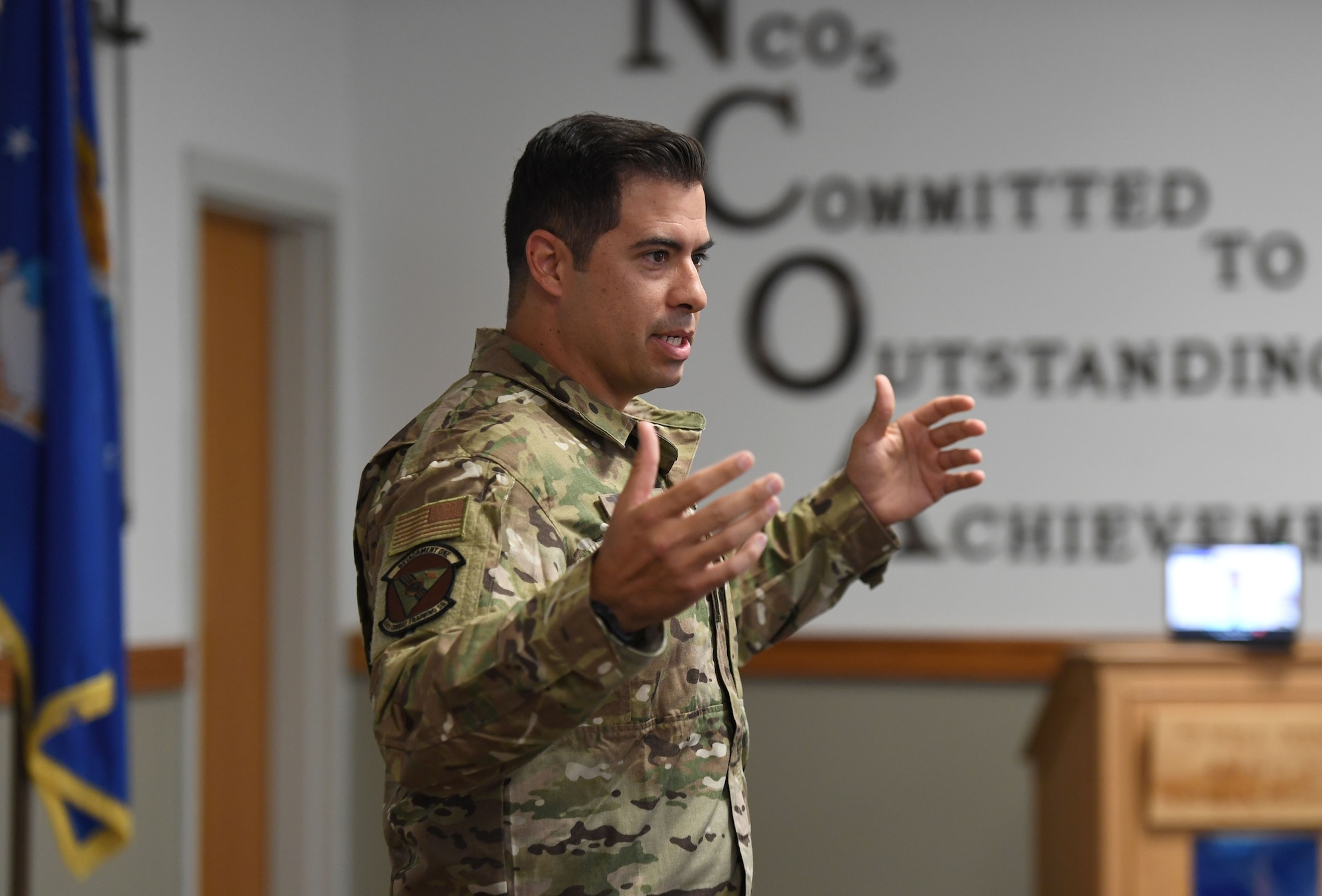 U.S. Air Force Tech. Sgt. August O'Niell, Air Force Wounded Warrior (AFW2) program ambassador, gives a brief to members of the NCO Academy inside Mathies Hall at Keesler Air Force Base, Mississippi, June 6, 2022. The AFW2 program provides concentrated non-medical care and support for combat wounded, ill and injured Airmen and their families as they recover and transition back to duty or into civilian life. (U.S. Air Force photo by Kemberly Groue)