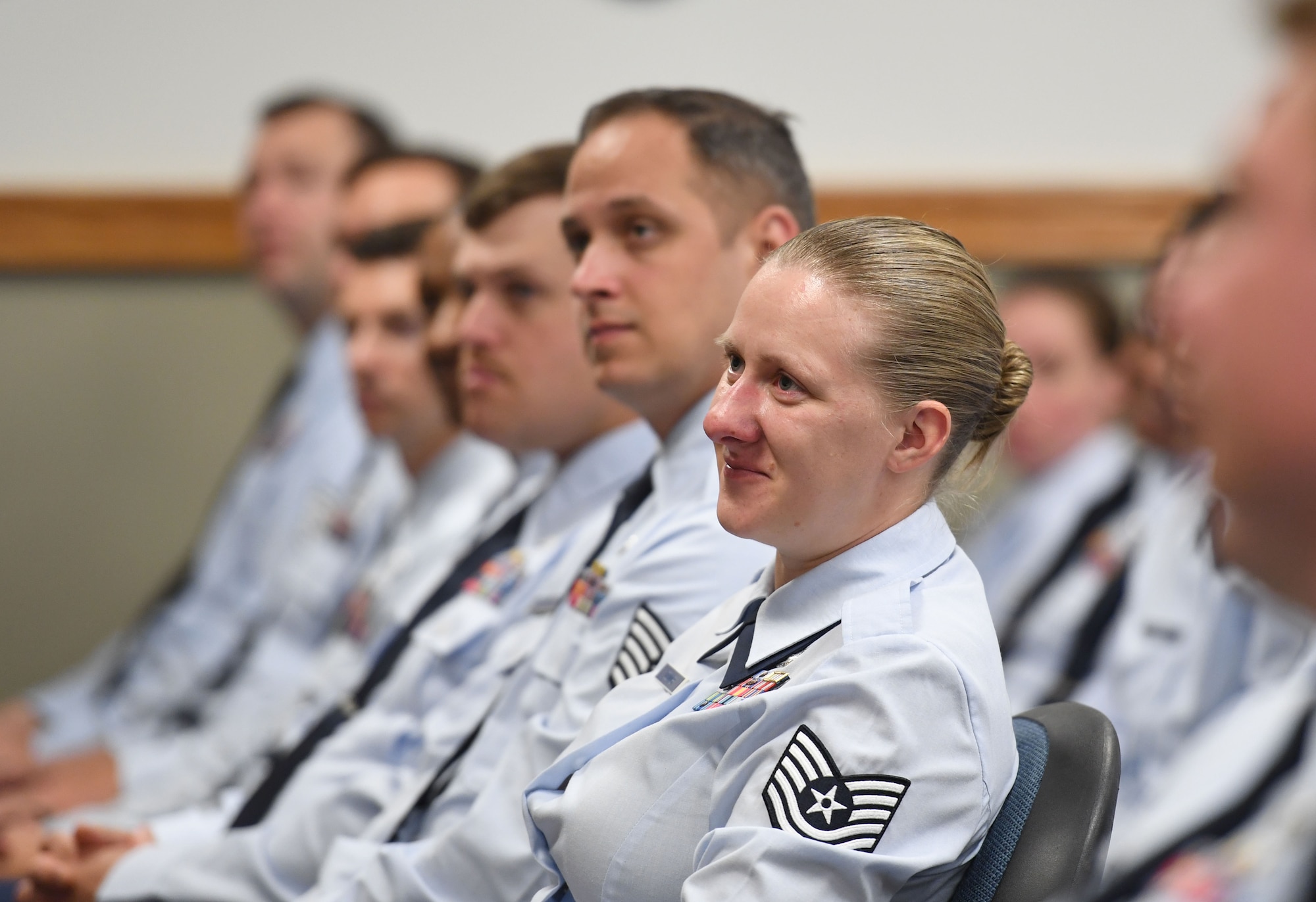 Members of the NCO Academy attend an Air Force Wounded Warrior (AFW2) program briefing inside Mathies Hall at Keesler Air Force Base, Mississippi, June 6, 2022. The AFW2 program provides concentrated non-medical care and support for combat wounded, ill and injured Airmen and their families as they recover and transition back to duty or into civilian life. (U.S. Air Force photo by Kemberly Groue)