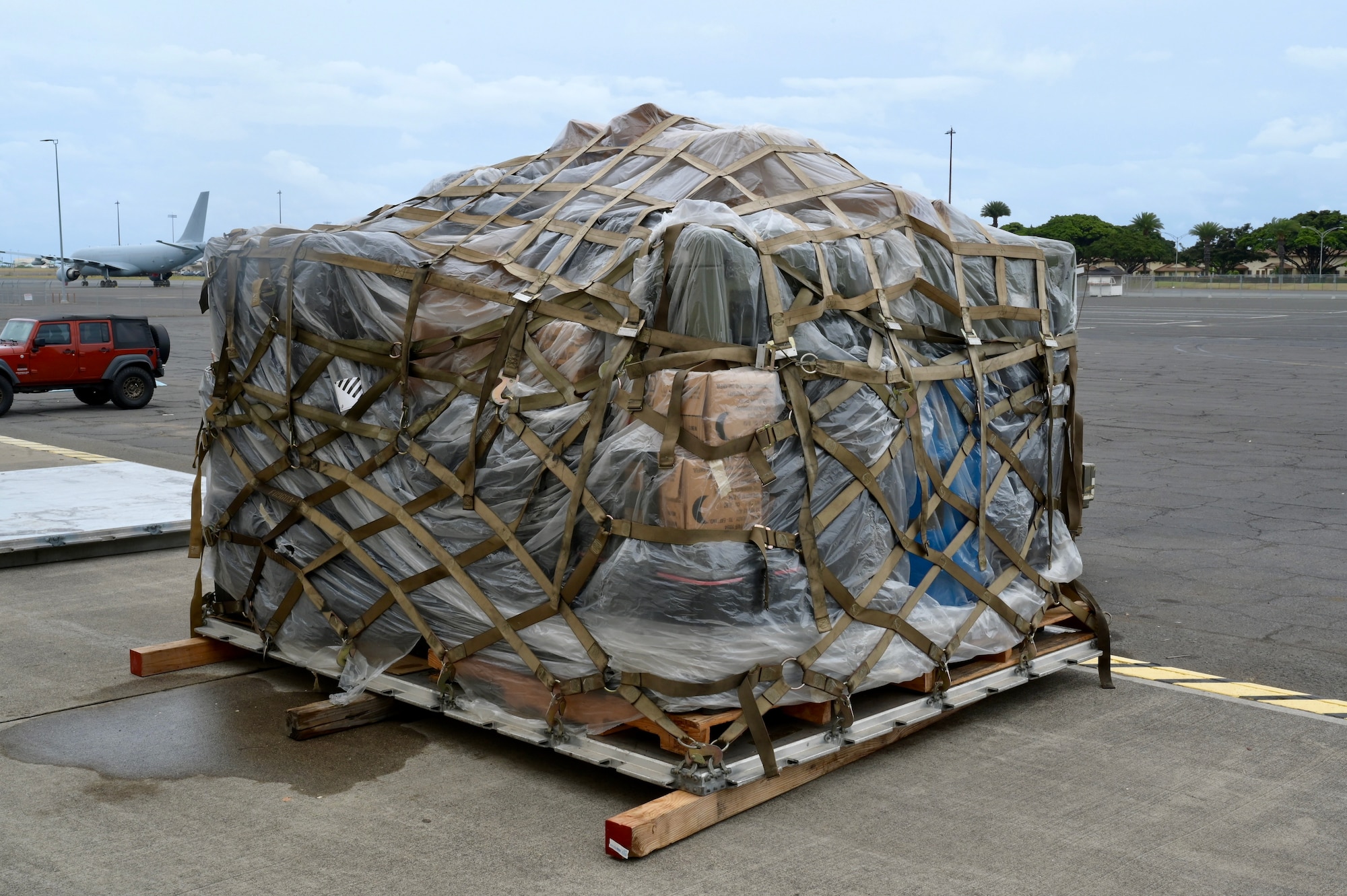 A fully prepared cargo pallet sits ready to go after being prepped by Airmen participating in a Multi-Capable Airmen training Tier 1 class at Joint Base Pearl Harbor-Hickam, Hawaii, May 18, 2022. The MCA training is poised to directly support the Agile Combat Employment doctrine by training Airmen to be able with skills outside their primary career field duties. (U.S. Air Force photo by 1st Lt. Benjamin Aronson)