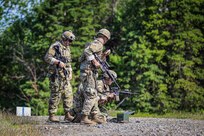 Alaska Army National Guardsmen prepare to get into the prone shooting position for their round of rifle qualification during the 2022 Adjutant General's Match held at Joint Base Elmendorf-Richardson, Alaska on June 4, 2022. Soldiers and Airmen across the Alaska National Guard competed in tests to become the next marksmanship champions of the annual TAG Match. (Alaska National Guard photo by Pvt. Caleb Lawhorne, 134th Public Affairs Detachment)