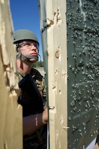 Alaska Air National Guard Capt. Maria Settanni, 176th Force Support Squadron operations officer, scores a competitor’s target, June 2, 2022, at Joint Base Elmendorf-Richardson during the 2022 Adjutant General's Match. Teams of four service members competed throughout the week in a series of combat pistol and rifle marksmanship tests for a spot on the Governor’s Twenty marksmanship team. (Alaska National Guard photo by David Bedard)