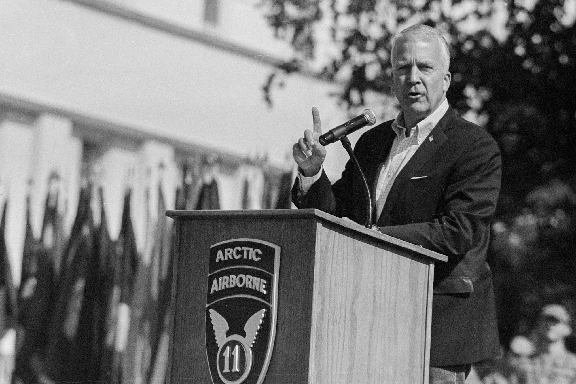 U.S. Senator Dan Sullivan speaks at a podium