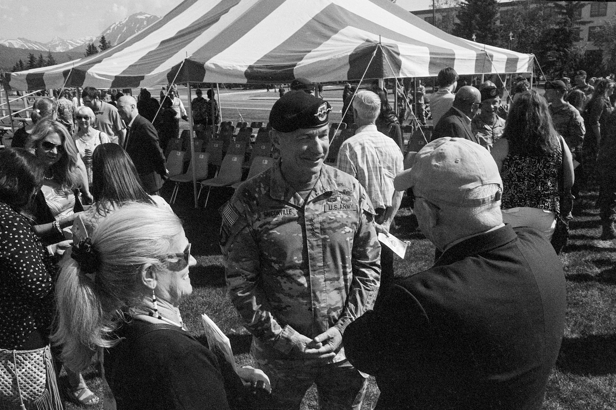 U.S. Army Chief of Staff General James McConville speaks with a group during a ceremony