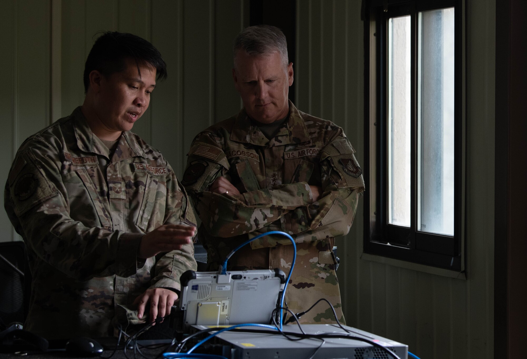 Two military members have a discussion.