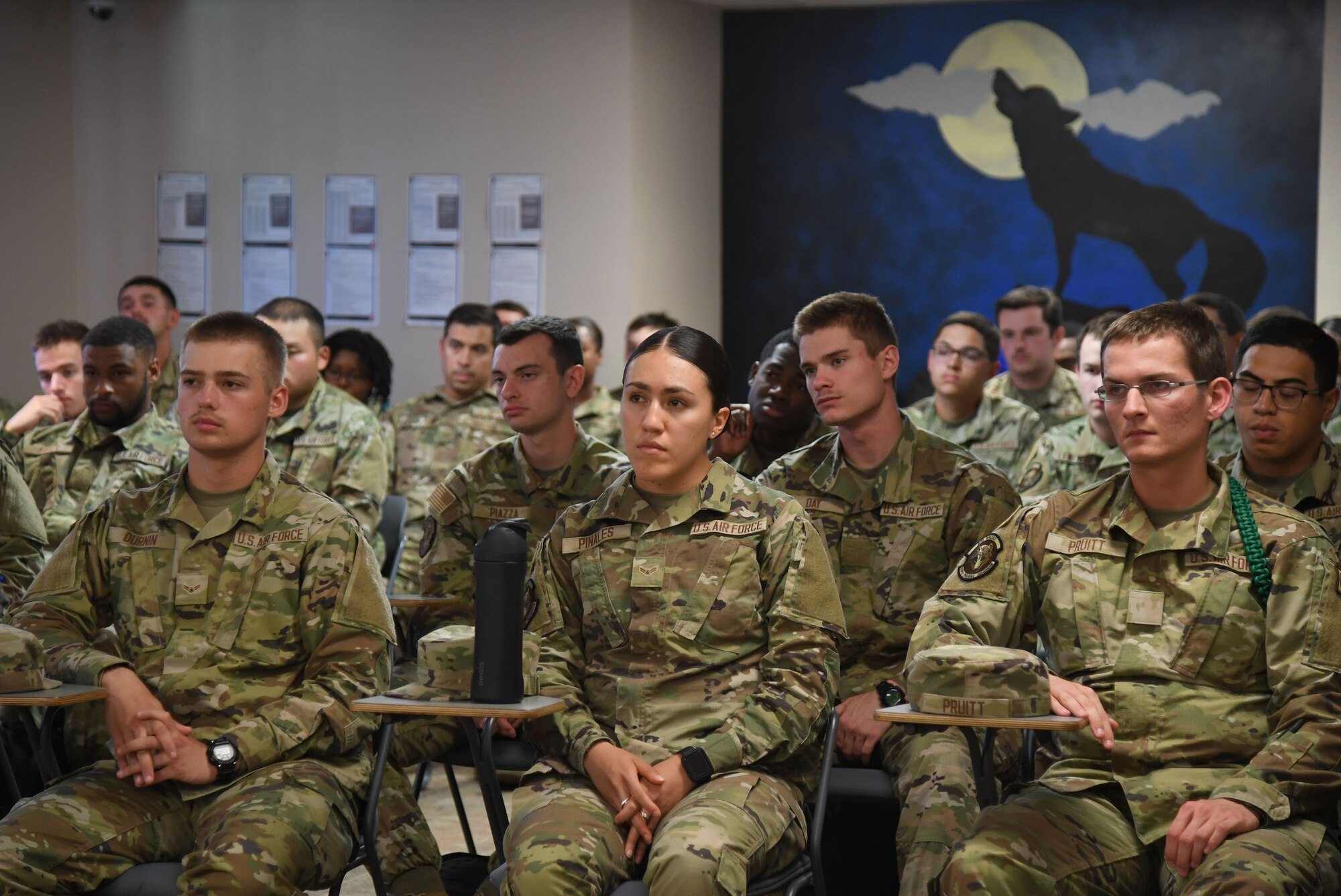 Students from the 336th Training Squadron attend an Air Force Wounded Warrior (AFW2) program briefing inside Holbrook Manor at Keesler Air Force Base, Mississippi, June 7, 2022. The AFW2 program provides concentrated non-medical care and support for combat wounded, ill and injured Airmen and their families as they recover and transition back to duty or into civilian life. (U.S. Air Force photo by Kemberly Groue)
