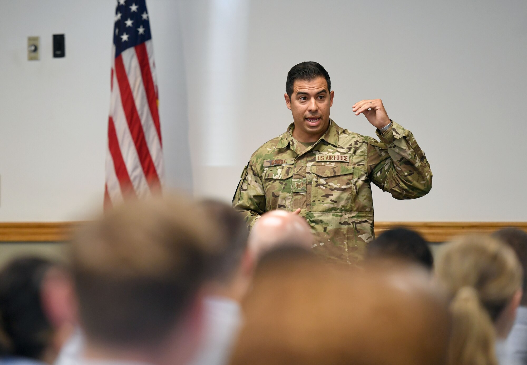 U.S. Air Force Tech. Sgt. August O'Niell, Air Force Wounded Warrior (AFW2) program ambassador, gives a brief to members of the NCO Academy inside Mathies Hall at Keesler Air Force Base, Mississippi, June 6, 2022. The AFW2 program provides concentrated non-medical care and support for combat wounded, ill and injured Airmen and their families as they recover and transition back to duty or into civilian life. (U.S. Air Force photo by Kemberly Groue)