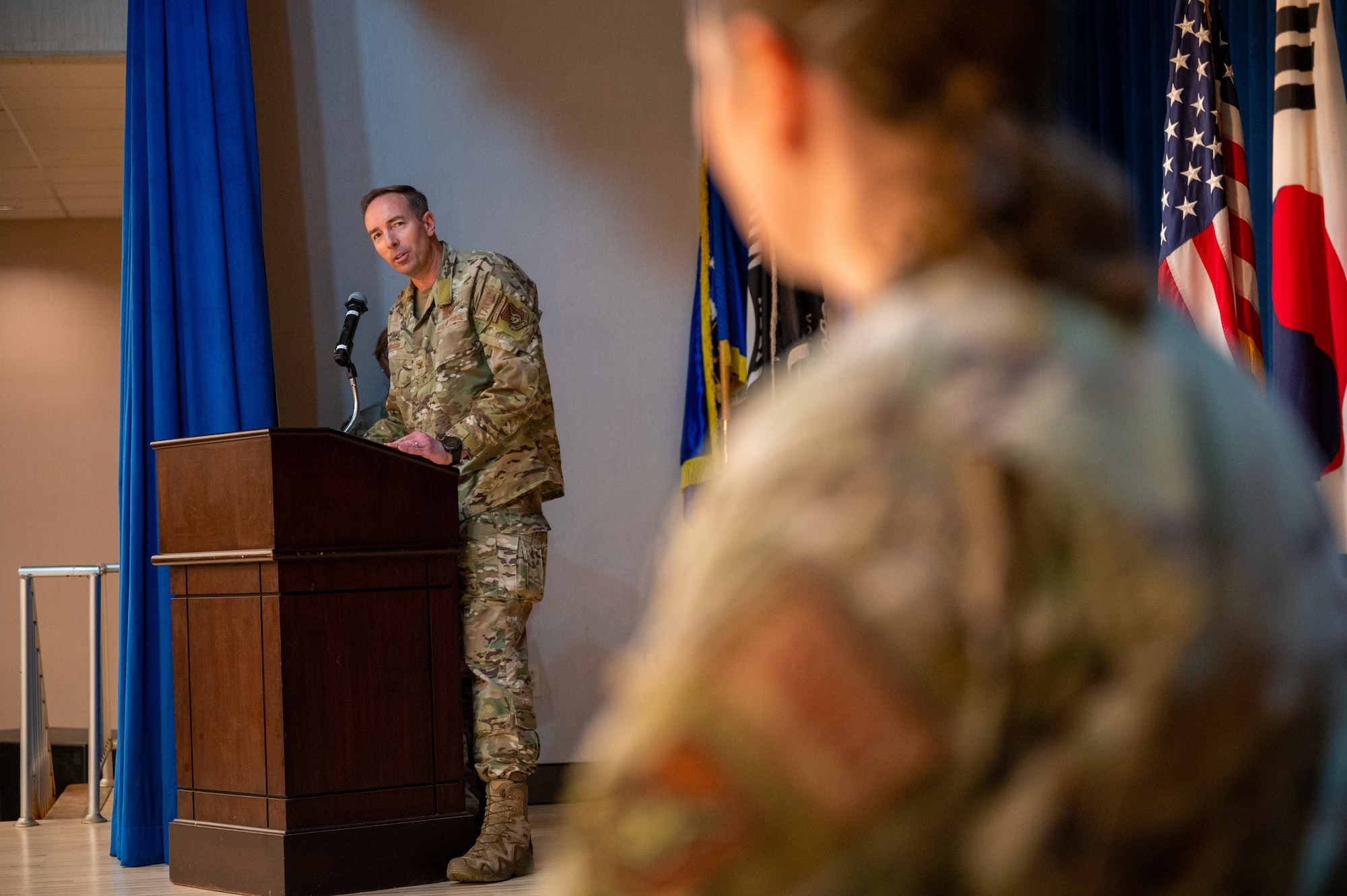 Col. Scott Morgan, 607th Air Support Operations Group commander, introduces Lt. Col. Nessa Hock, the incoming 607th Combat Weather Squadron’s commander