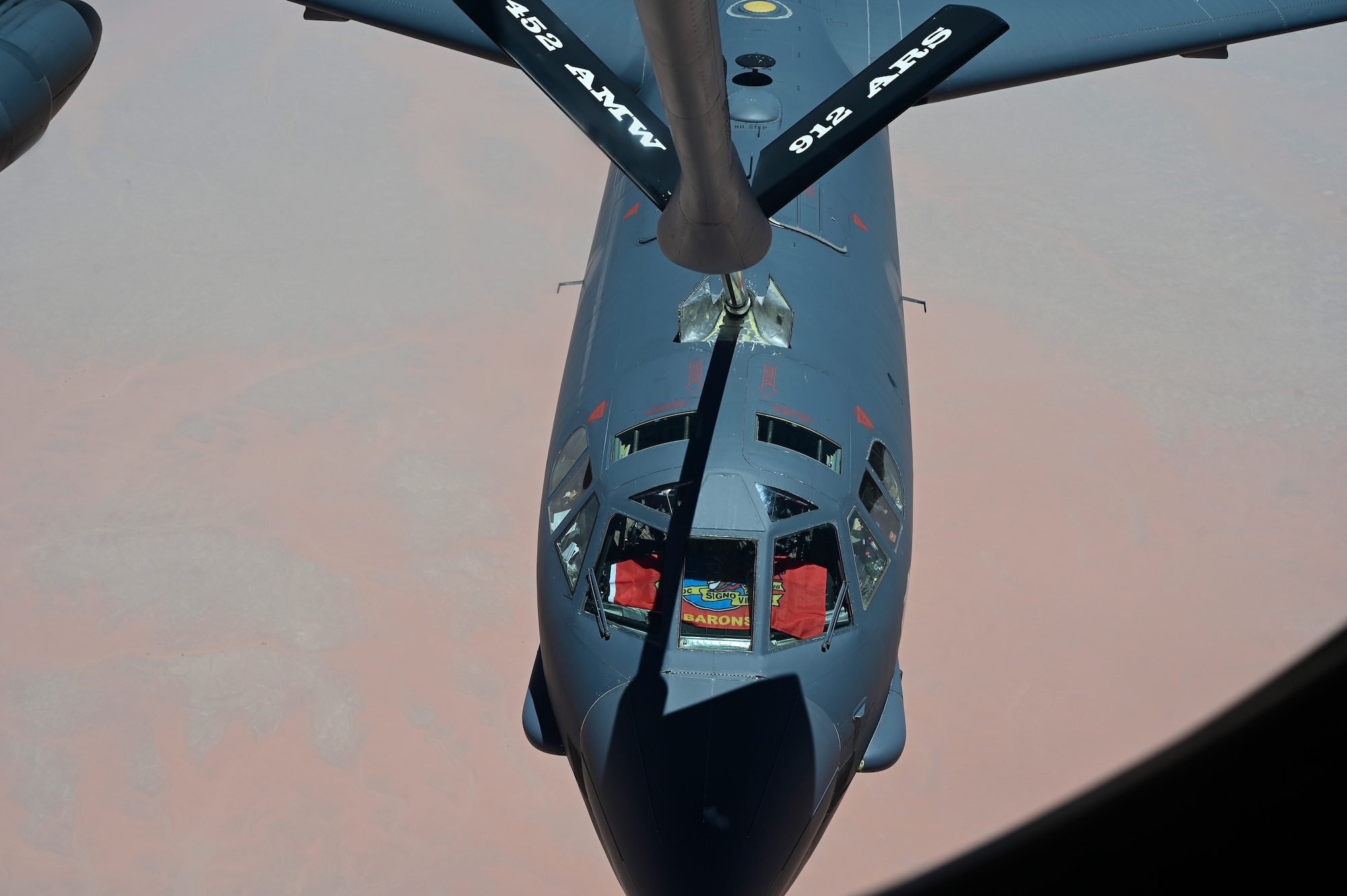 U.S. Air Force B-52 Stratofortress, assigned to the 5th Bomb Wing is refueled by a KC-135 Stratotanker assigned to the 350th Expeditionary Air Refueling Squadron over the U.S. Central Command area of responsibility June 8, 2022. The B-52 conducted a presence patrol mission to demonstrate the U.S.-led coalition commitment to promoting reginal stability. (U.S. Air Force photo by Staff Sgt. Ashley Sokolov)