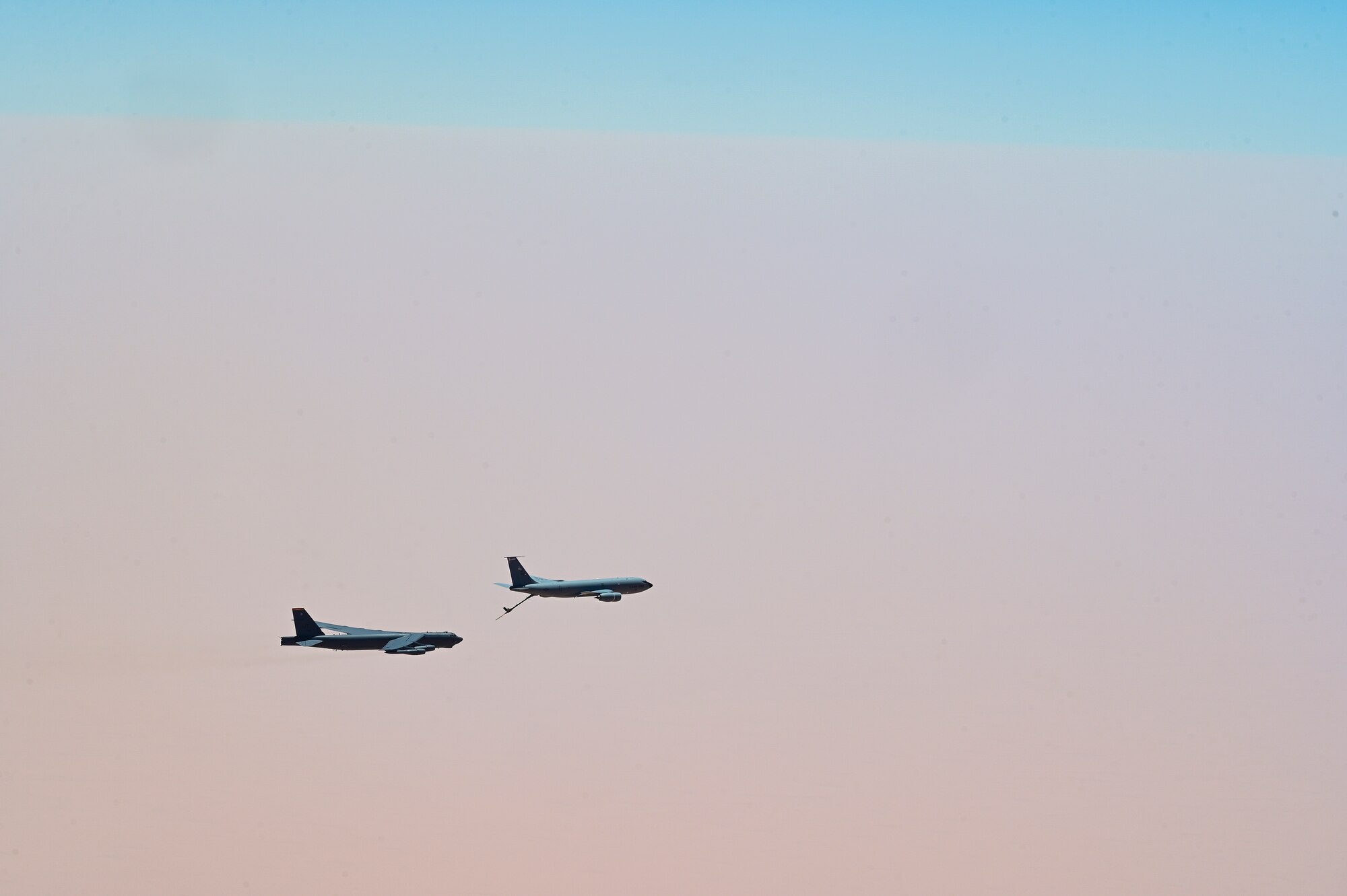 U.S. Air Force B-52 Stratofortress, assigned to the 5th Bomb Wing, is refueled by a KC-135 Stratotanker assigned to the 350th Expeditionary Air Refueling Squadron, within the U.S. Central Command area of responsibility, June 8, 2022. The B-52 conducted a presence patrol mission with coalition and regional partners. (U.S. Air Force photo by Staff Sgt. Ashley Sokolov)