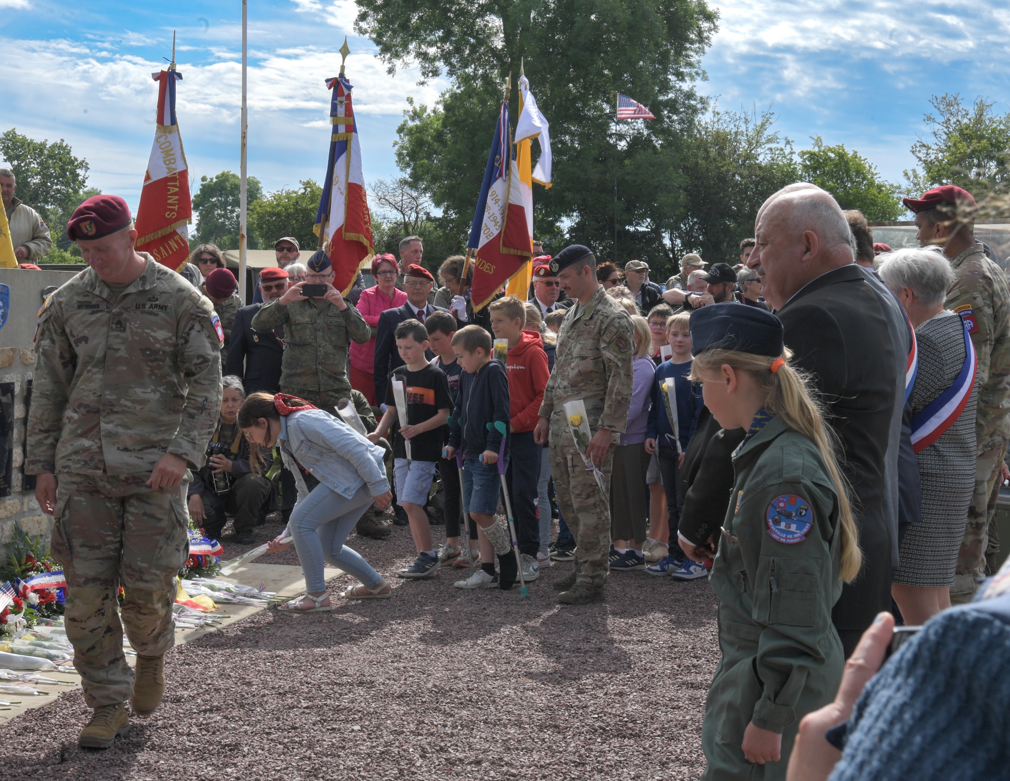 Attendees pay their respects by laying flowers and wreaths for the fallen at the Airborne Memorial Ceremony at Picauville, France, June 2, 2022. The ceremony was held in remembrance of the 78th anniversary of D-Day. (U.S. Air Force photo by Airman 1st Class Lauren Jacoby)