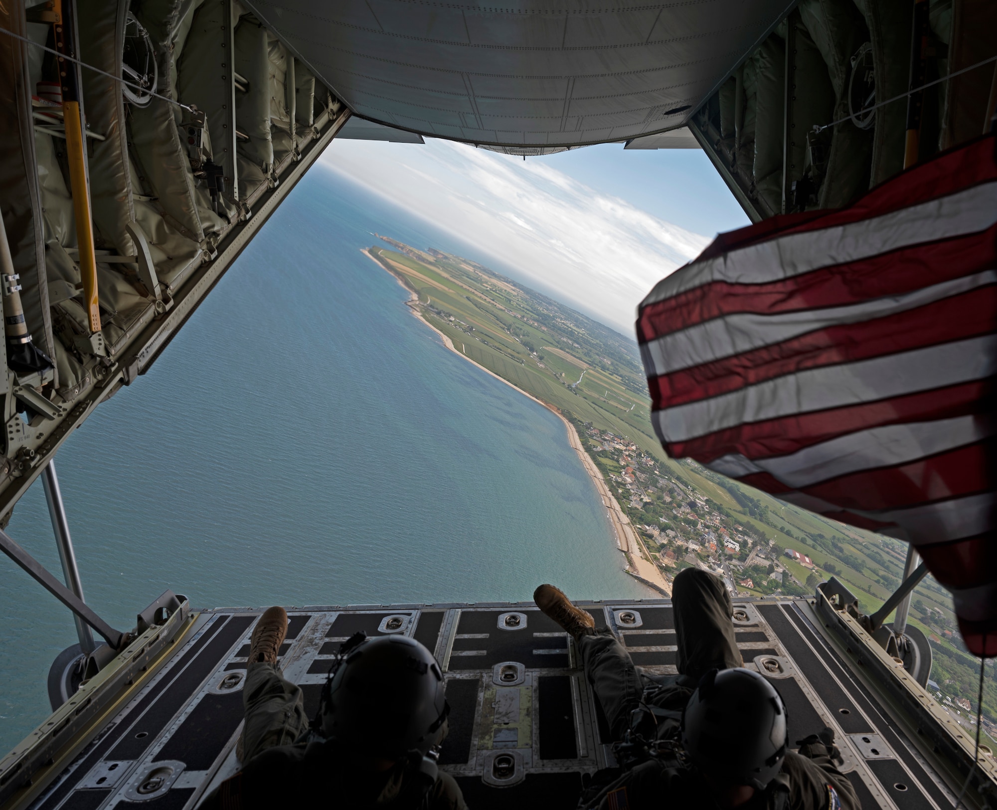 A C-130J Super Hercules aircraft assigned to the 37th Airlift Squadron out of Ramstein Air Base, Germany, flies over the beaches of Normandy, France, during a D-Day ceremony, June 2, 2022. The 37th AS participated in the 78th D-Day memorial, where they took part in ceremonies, flyovers and demonstrations as a way to pay respect to those who gave their lives to free France during World War II. (U.S. Air Force photo by Senior Airman Thomas Karol)