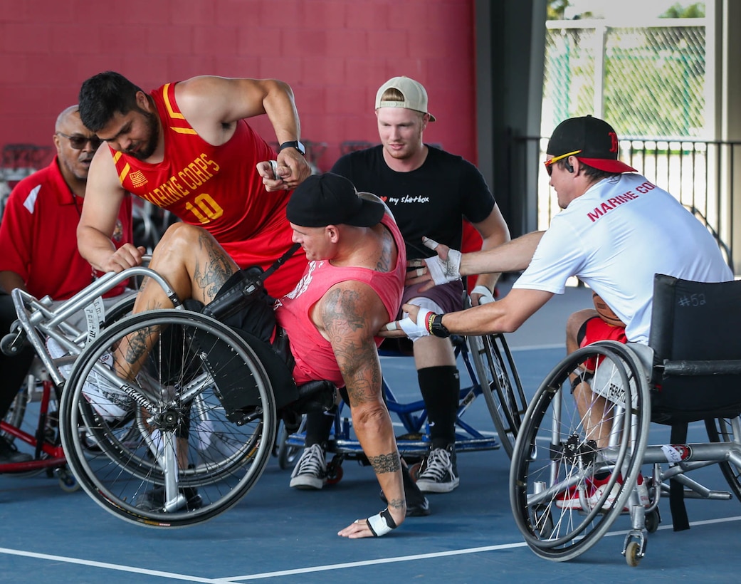 Recovering service members with the Wounded Warrior Regiment play a game of wheelchair basketball during a training camp in San Antonio, Texas, June 8, 2022. Marines attended the camp to hone their skills in wheelchair basketball, wheelchair rugby, and sitting volleyball to prepare for the 2022 DoD Warrior Games. The DoD Warrior Games is a multi-sport event for wounded, ill, and injured service members.