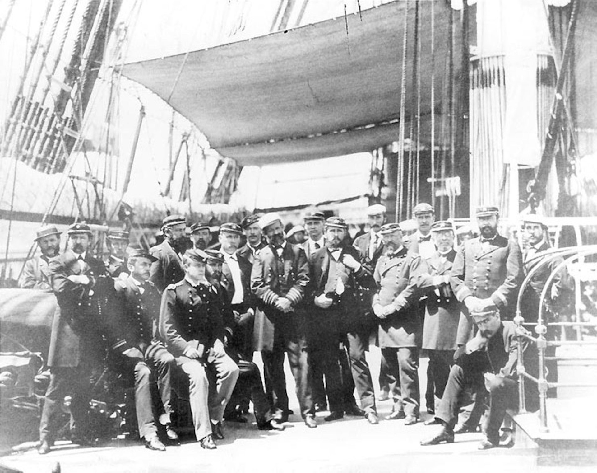 Expedition officers, on board USS Colorado, McKee, first one seated at far left. US Naval Historical Center Photograph.