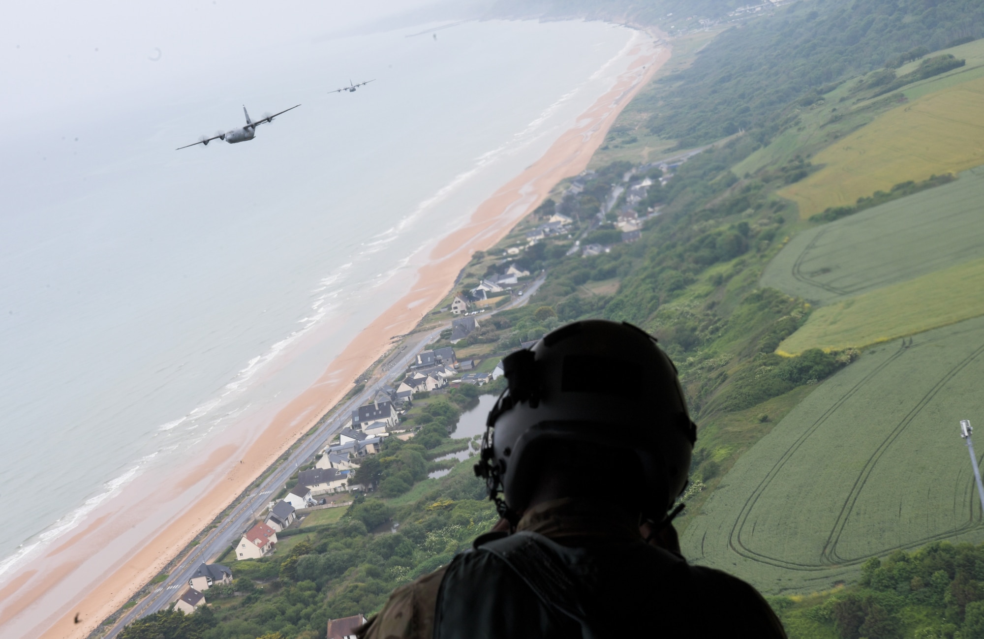 Three C-130J Super Hercules aircraft from the 37th Airlift Squadron out of Ramstein Air Base, Germany, flew over the beaches of Normandy, France, June 3, 2022. The 37th AS participated in multiple flyover demonstrations to pay tribute to the 78th anniversary of D-Day. (U.S. Air Force photo by Airman 1st Class Lauren Jacoby)