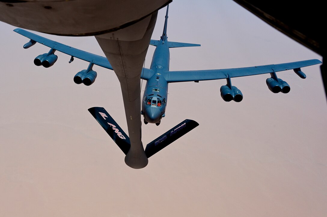 A U.S. Air Force B-52 Stratofortress, assigned to the 5th Bomb Wing, conducts aerial refueling with a KC-135 Stratotanker, assigned the 350th Expeditionary Air Refueling Squadron, during a presence patrol mission with coalition and regional partners within the U.S. Central Command area of responsibility, June 8, 2022. Presence patrol missions demonstrate the U.S.-led coalition's commitment to promoting regional stability. (U.S. Air Force photo by Master Sgt. Matthew Plew)
