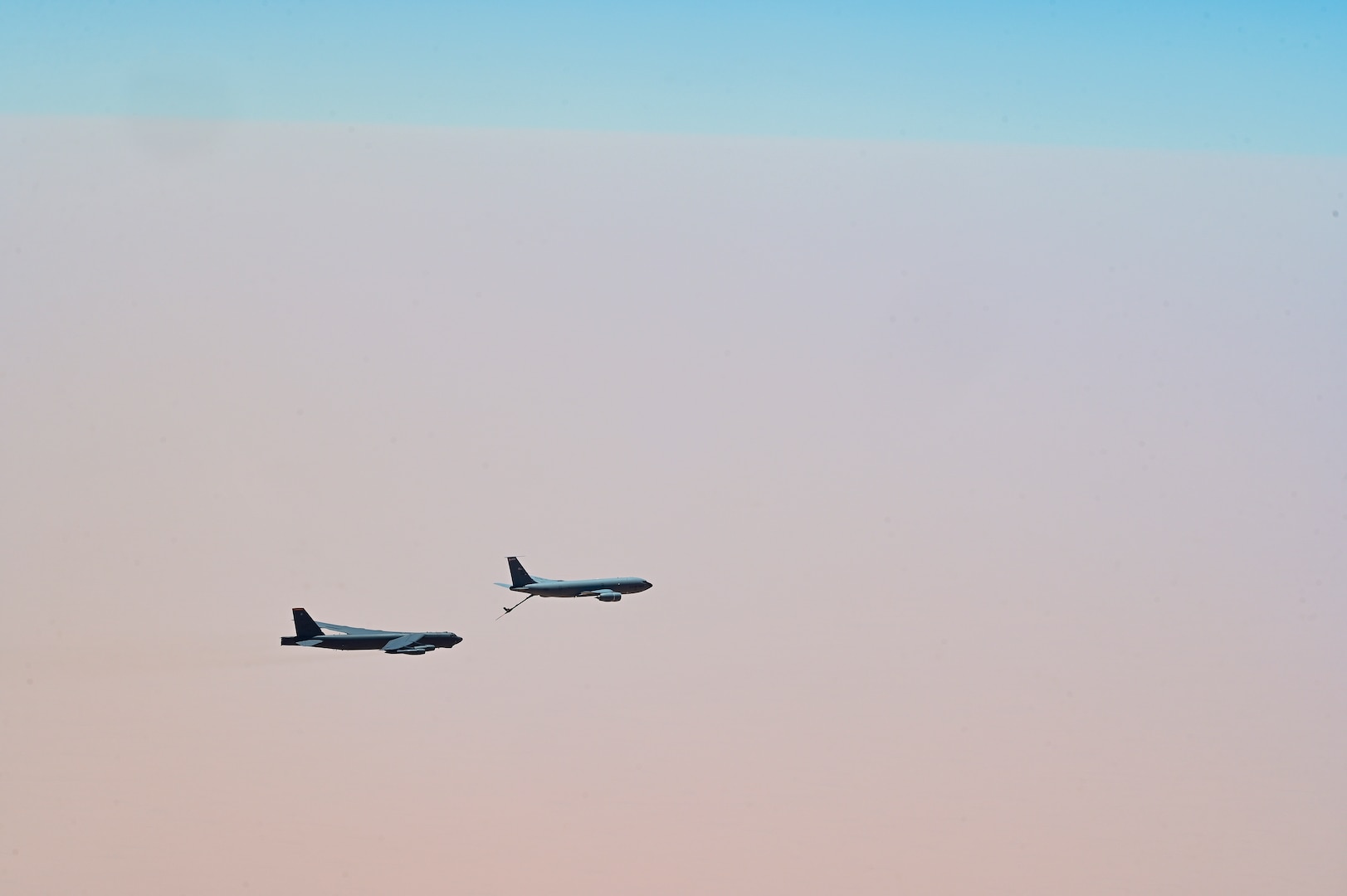 U.S. Air Force B-52 Stratofortress, assigned to the 5th Bomb Wing, is refueled by a KC-135 Stratotanker assigned to the 350th Expeditionary Air Refueling Squadron, within the U.S. Central Command area of responsibility, June 8, 2022. The B-52 conducted a presence patrol mission with coalition and regional partners. (U.S. Air Force photo by Staff Sgt. Ashley Sokolov)