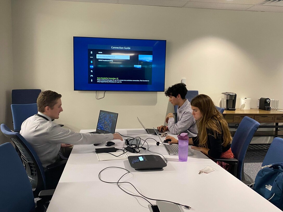 Civil engineer and TAM's High School Intern Program Manager Garrison Myer meets with two interns and mentors through the use software and other tools of the trade. Here Sebastian Rincon-Camacho and Mikayla Balio are introduced to technical software to be used in their project designs.