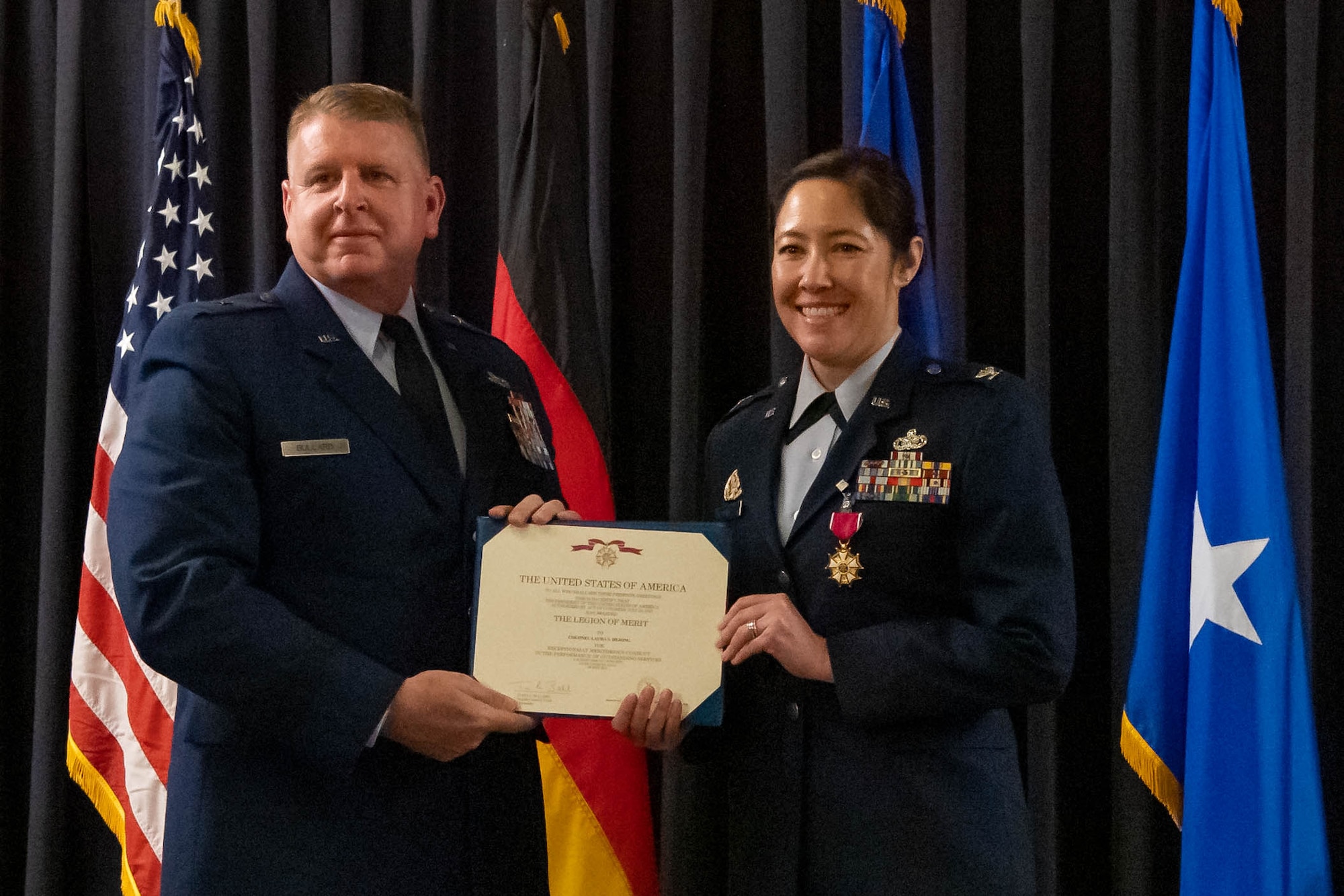 Airman is presented with certificate.