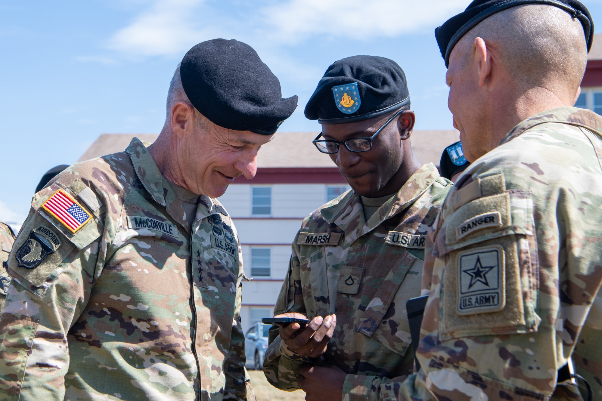 U.S. Army Chief of Staff General James McConville speaks with soldiers during a ceremony