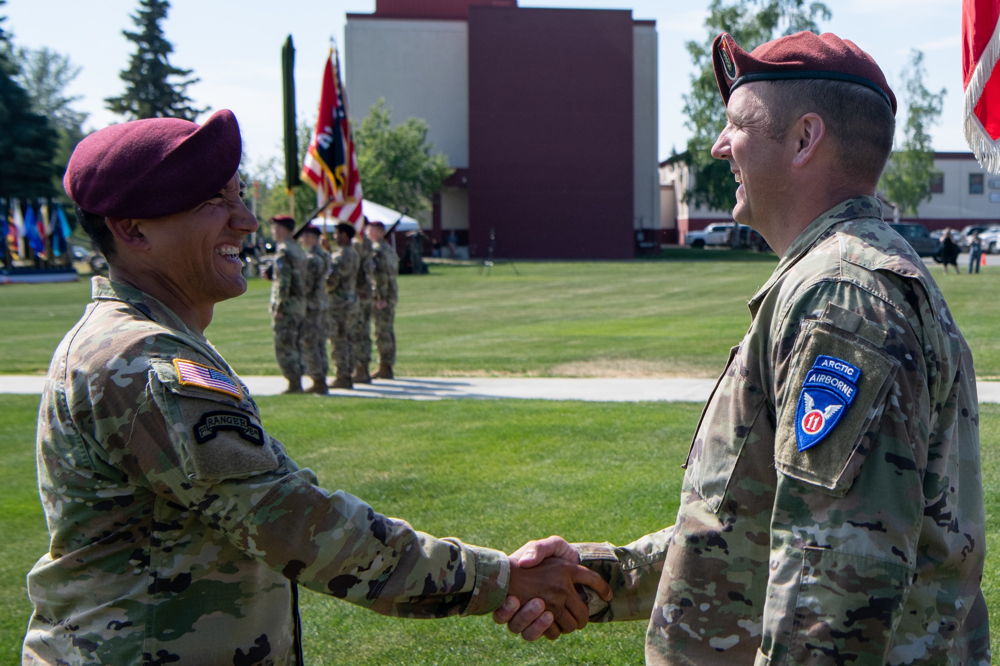 Soldiers shake hands during a ceremony