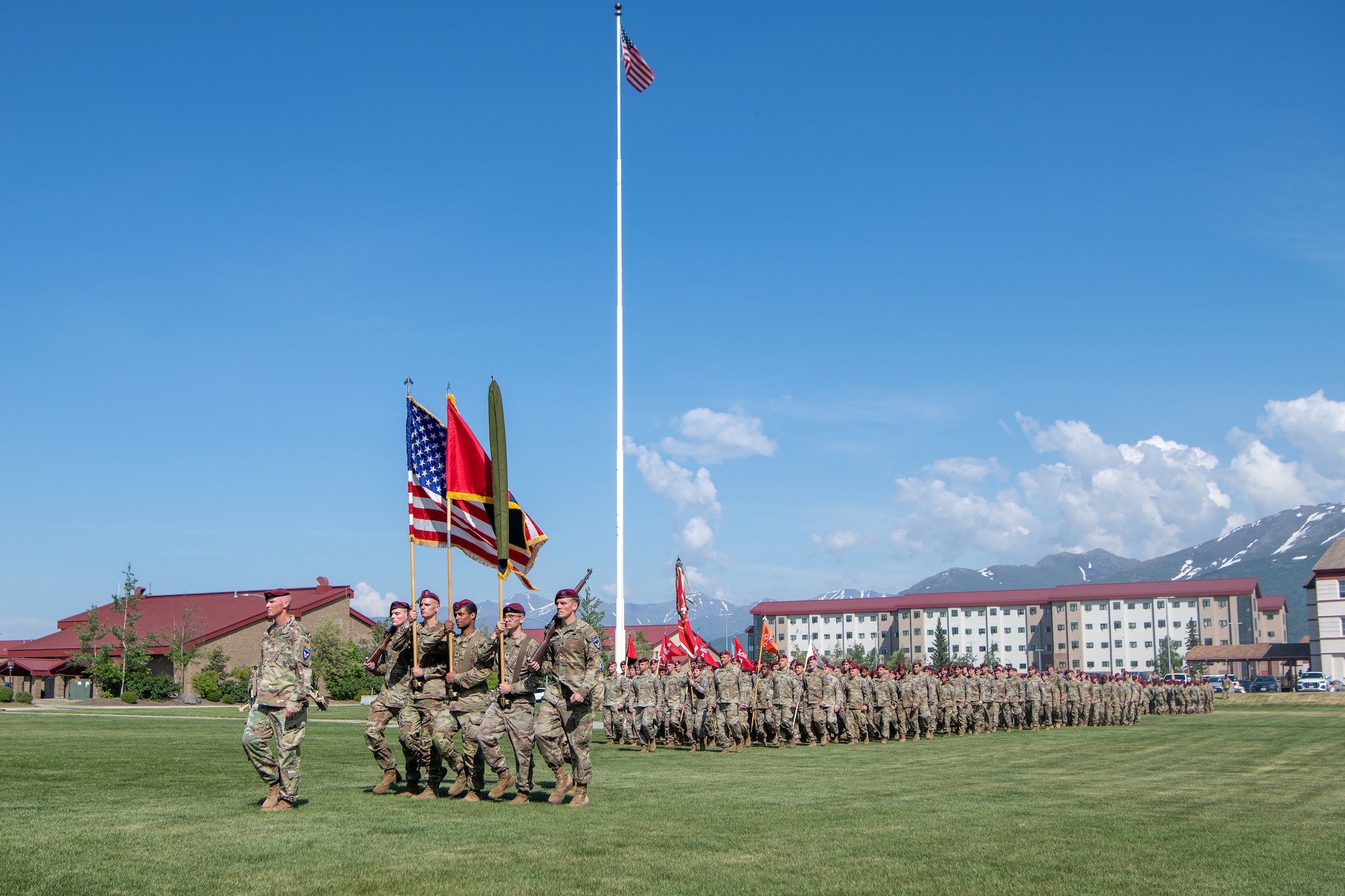 Soldiers march off of the parade grounds after a ceremony