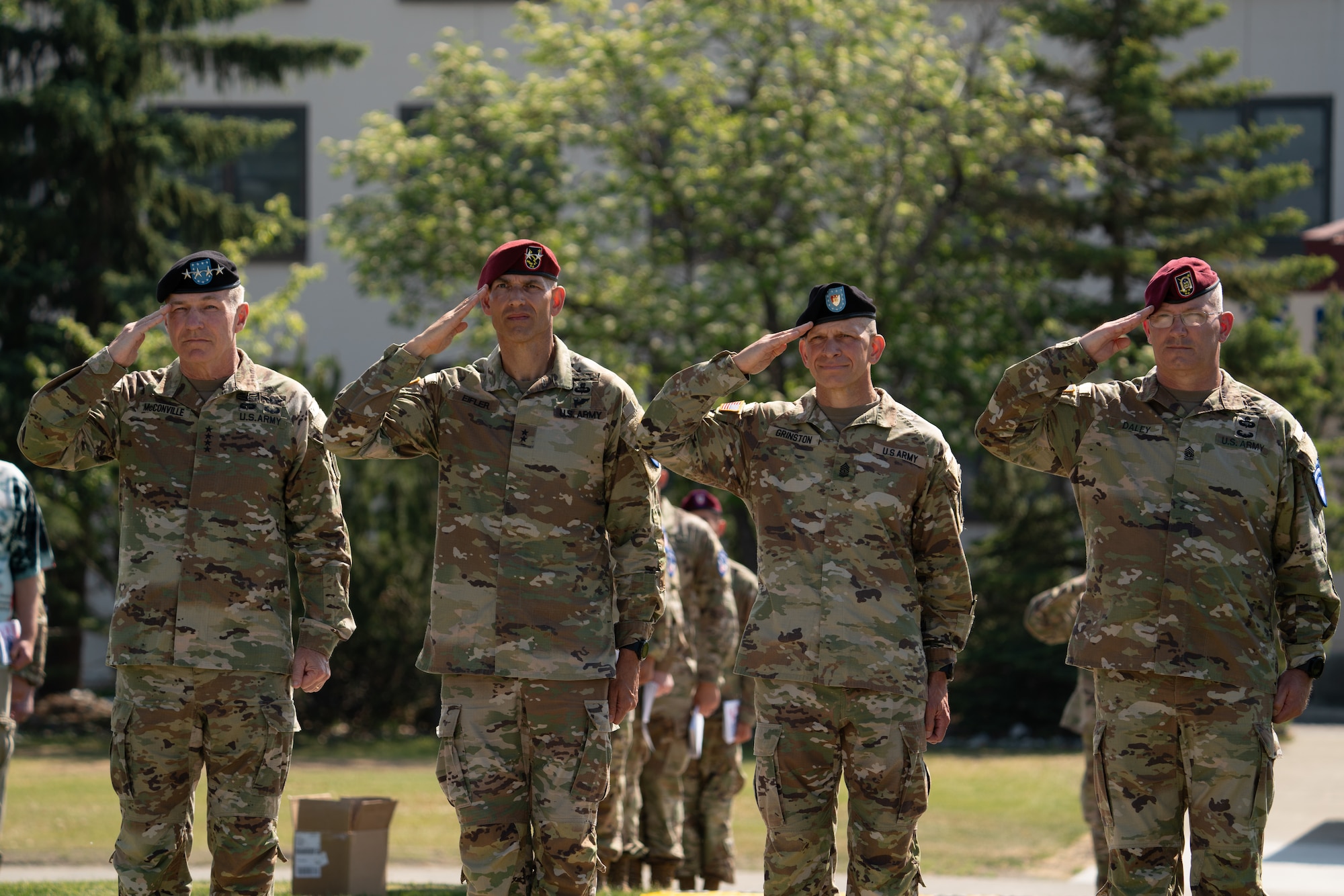 U.S. Army leadership render salutes during a ceremony